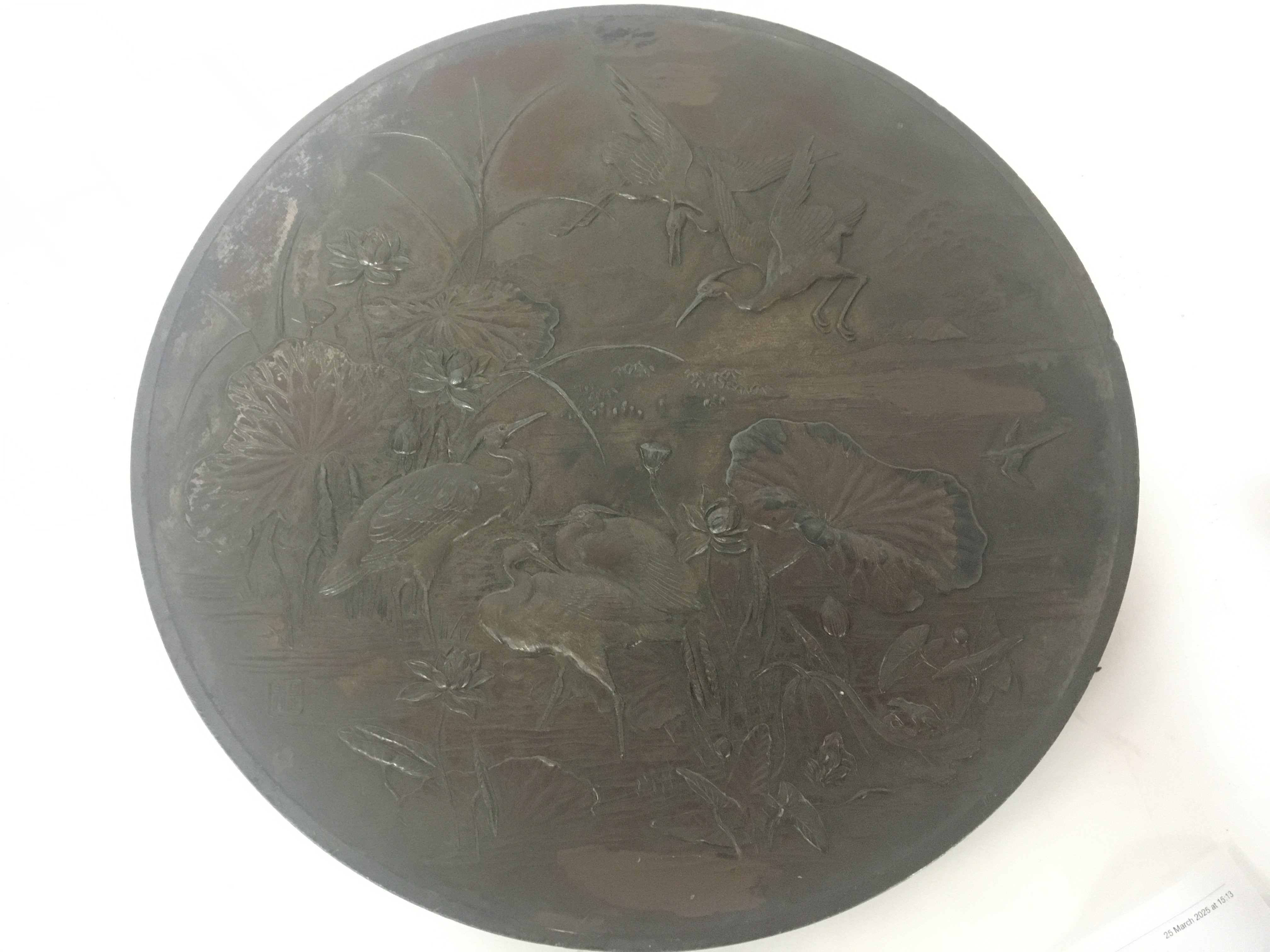 A Quality Japanese 19th century bronzed metal plaque with raised stalks and lily pads signed with a seal mark diameter 46cm