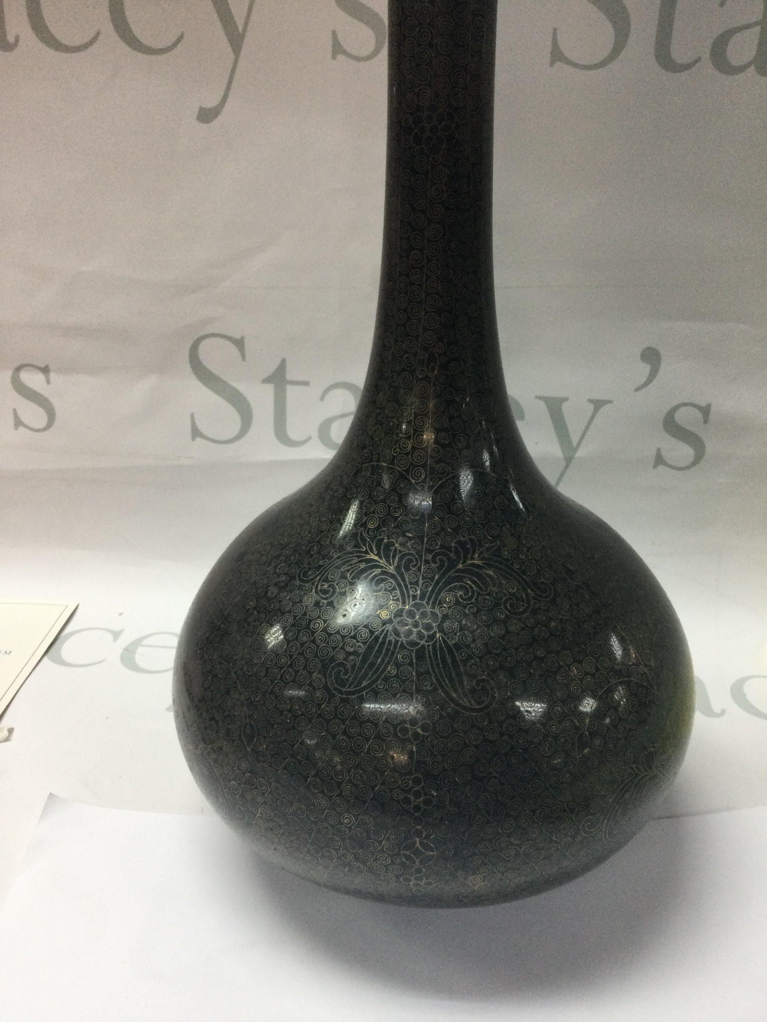 A Chinese cloisonn̩ vases the lack ground with floral design. 39 cm .