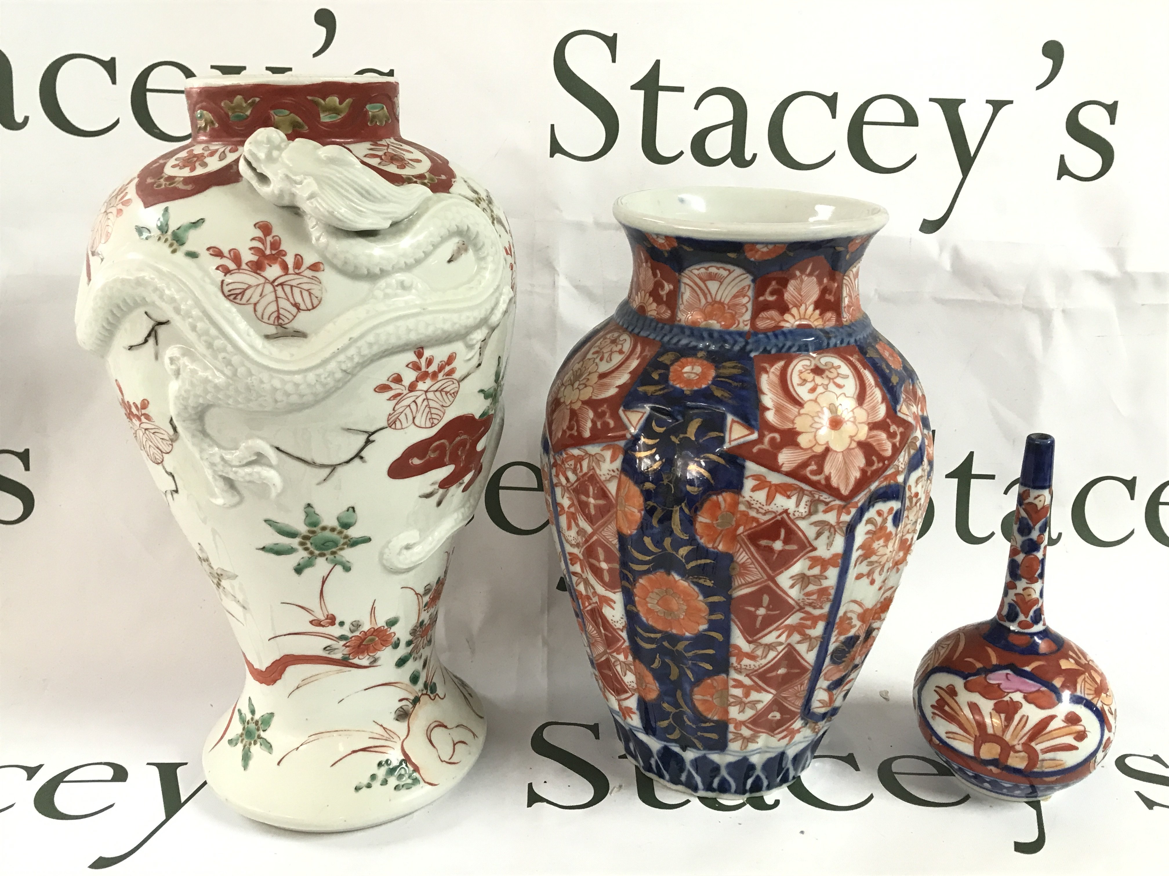 Three Japanese porcelain vases including Imari ware and a dragon vase . This lot cannot be posted