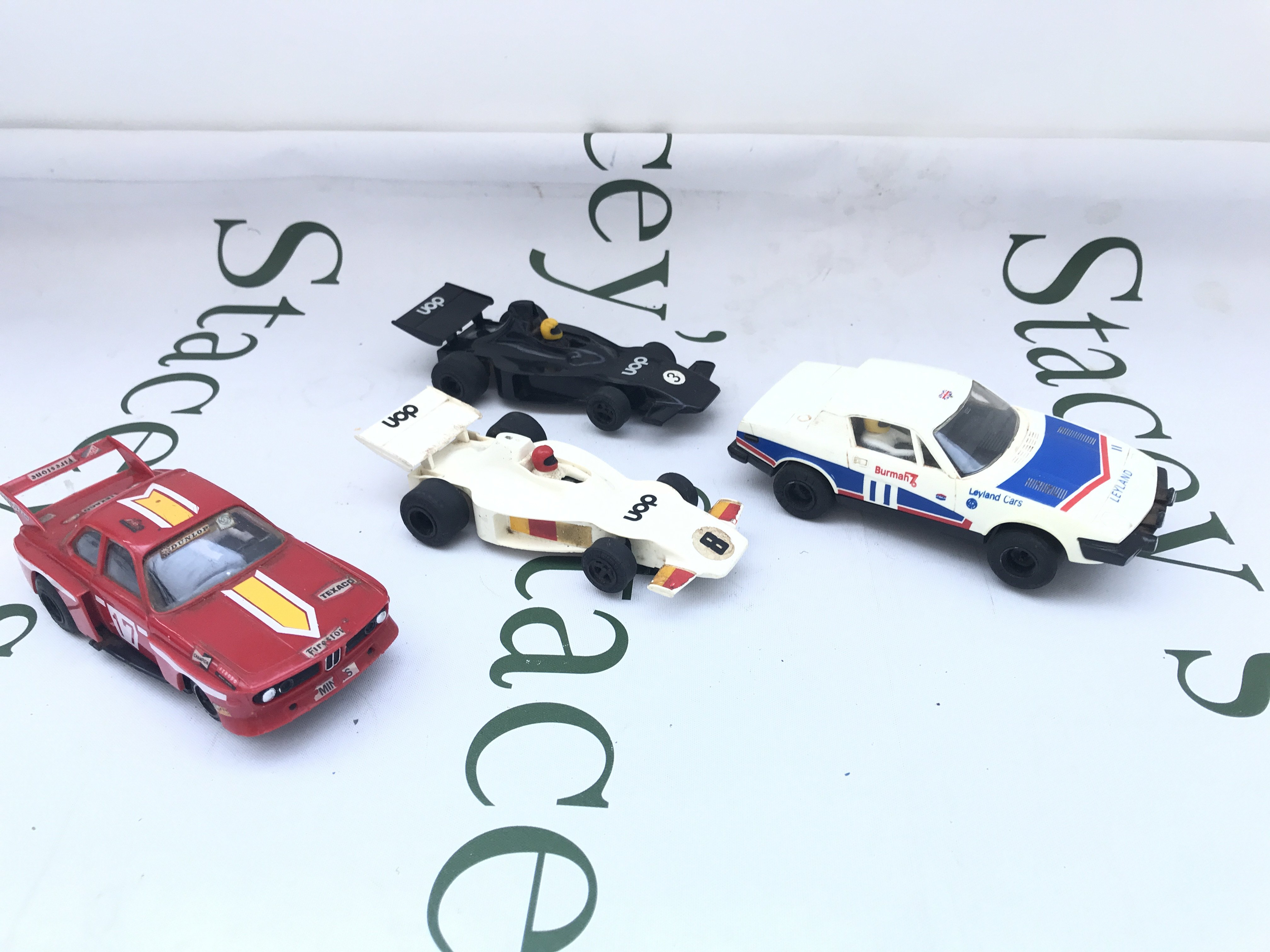 4 Vintage Scalextric Cars And A Collection of Track and Controllers.