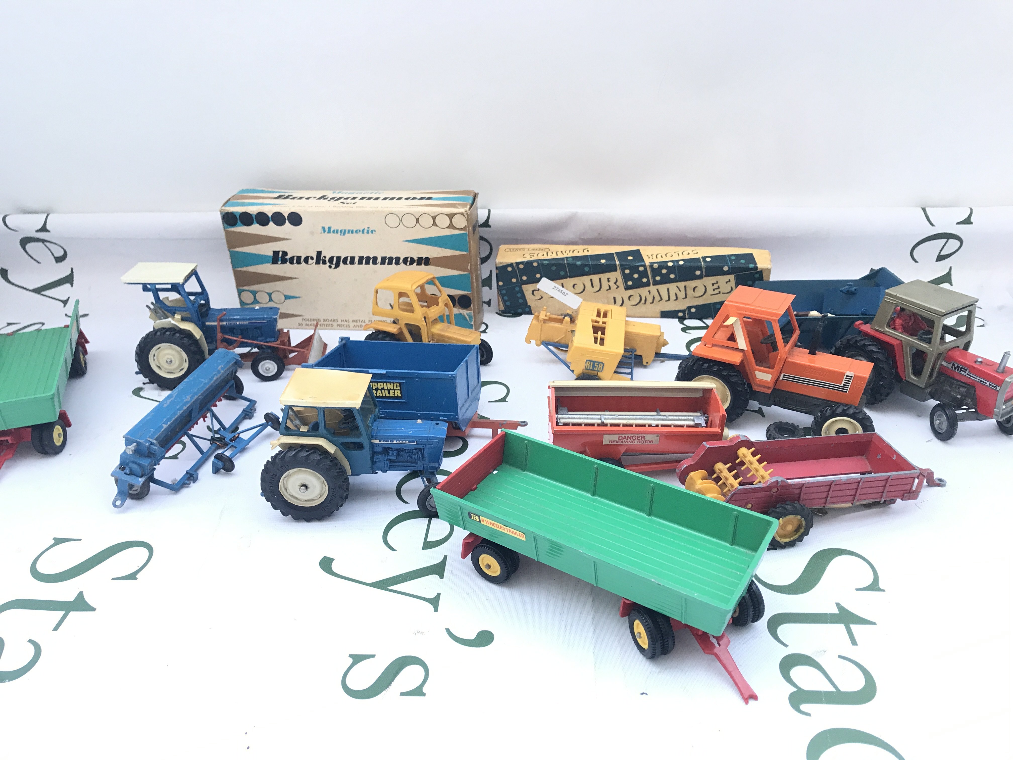 A Box Containing Mostly Playworn Britains Farming Toys. No Reserve.