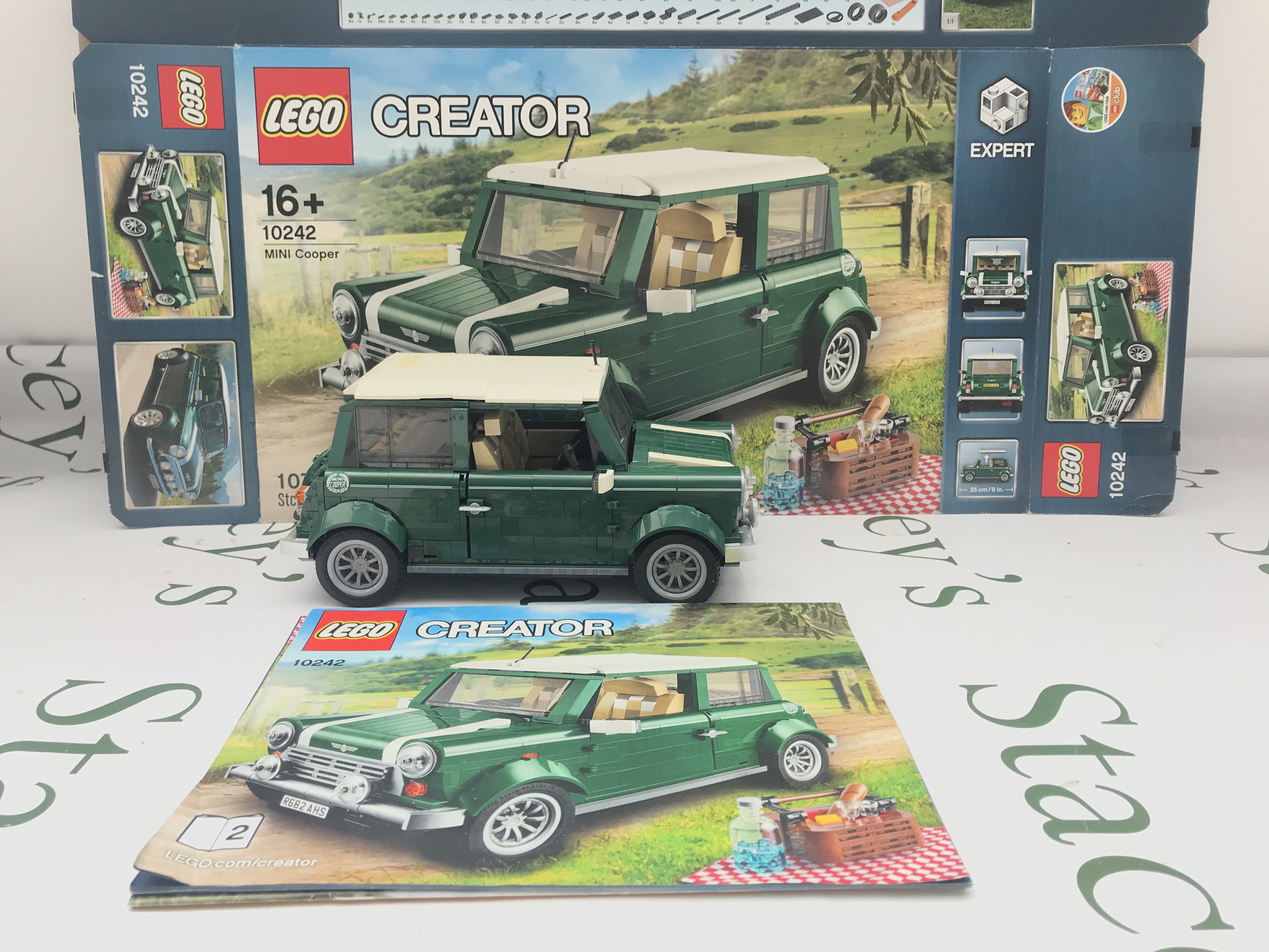 A Lego Mini Cooper #10242 With Box And Manual. Appears Complete. This Lot Cannot Be Posted In House. (2).