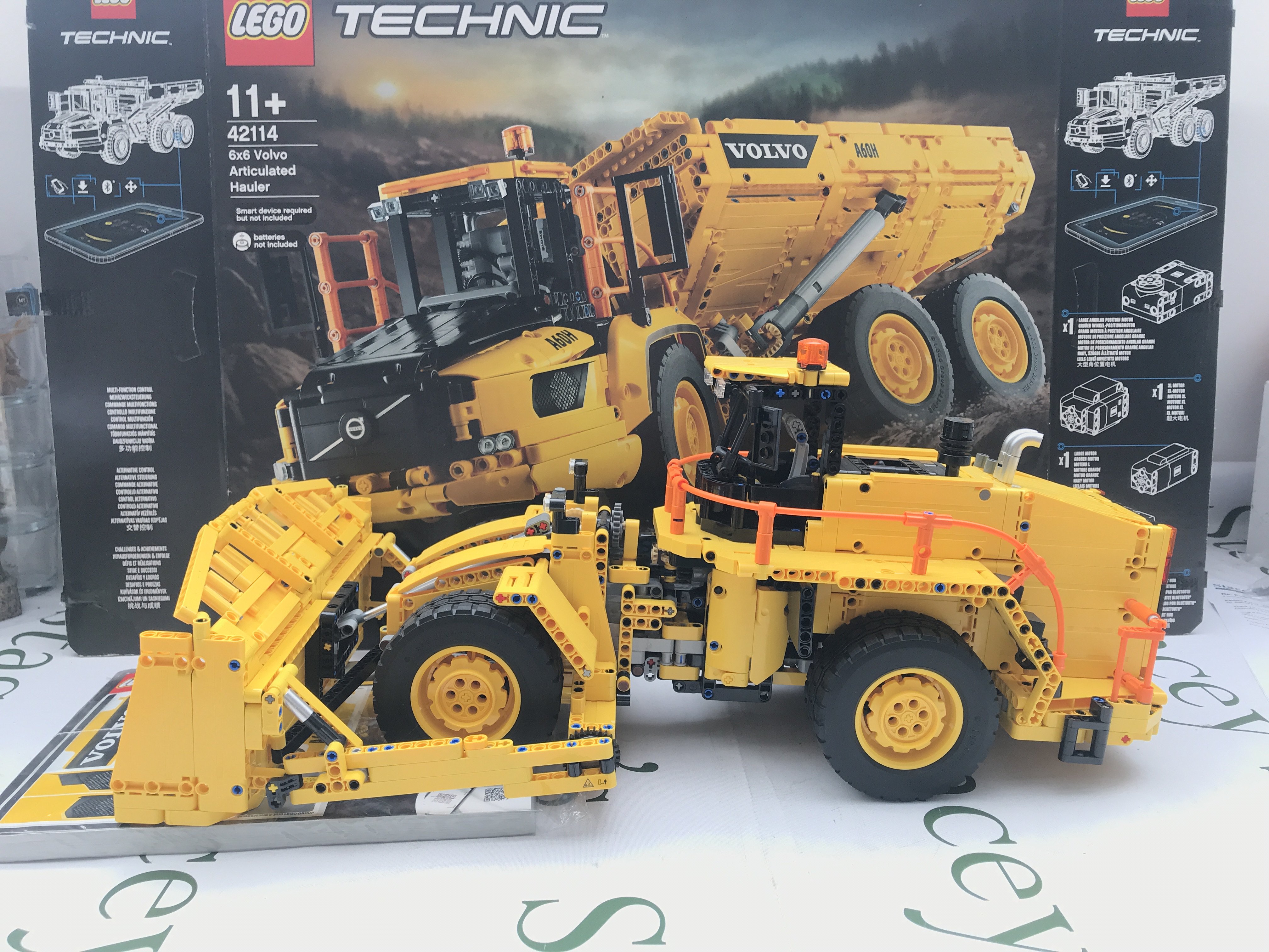 A Lego 6X6 Volvo Articulated Hauler Turned Into A Dozer #42114. With Box And Manual. This Lot Cannot Be Posted In House.(2).