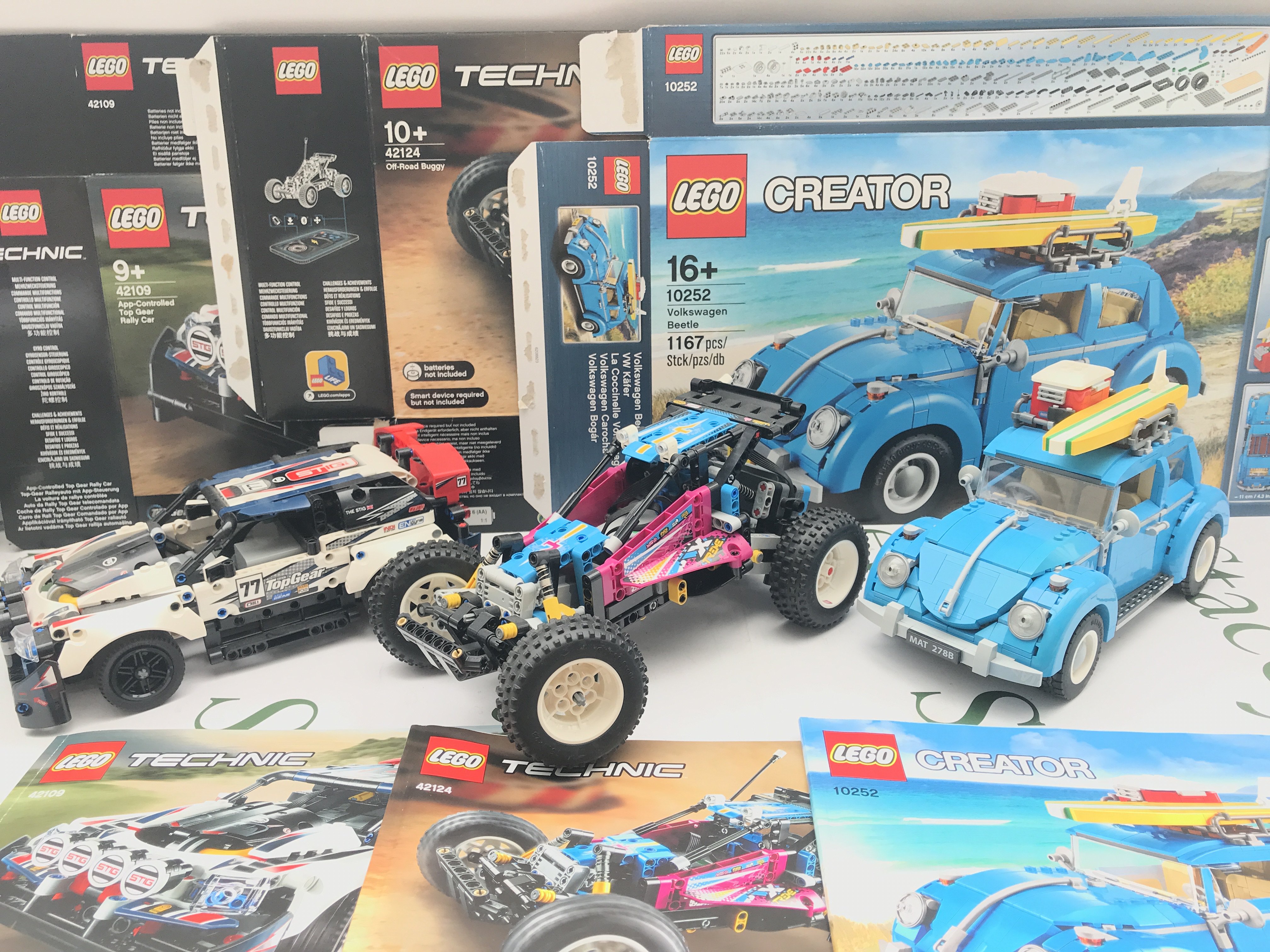A Lego App-Controlled Top Gear Rally Car #42109. A Off-Road Buggy #42124 And A Volkswagen Beetle #10252. All With Manuals And Boxes. This Lot Cannot Be Posted In House.