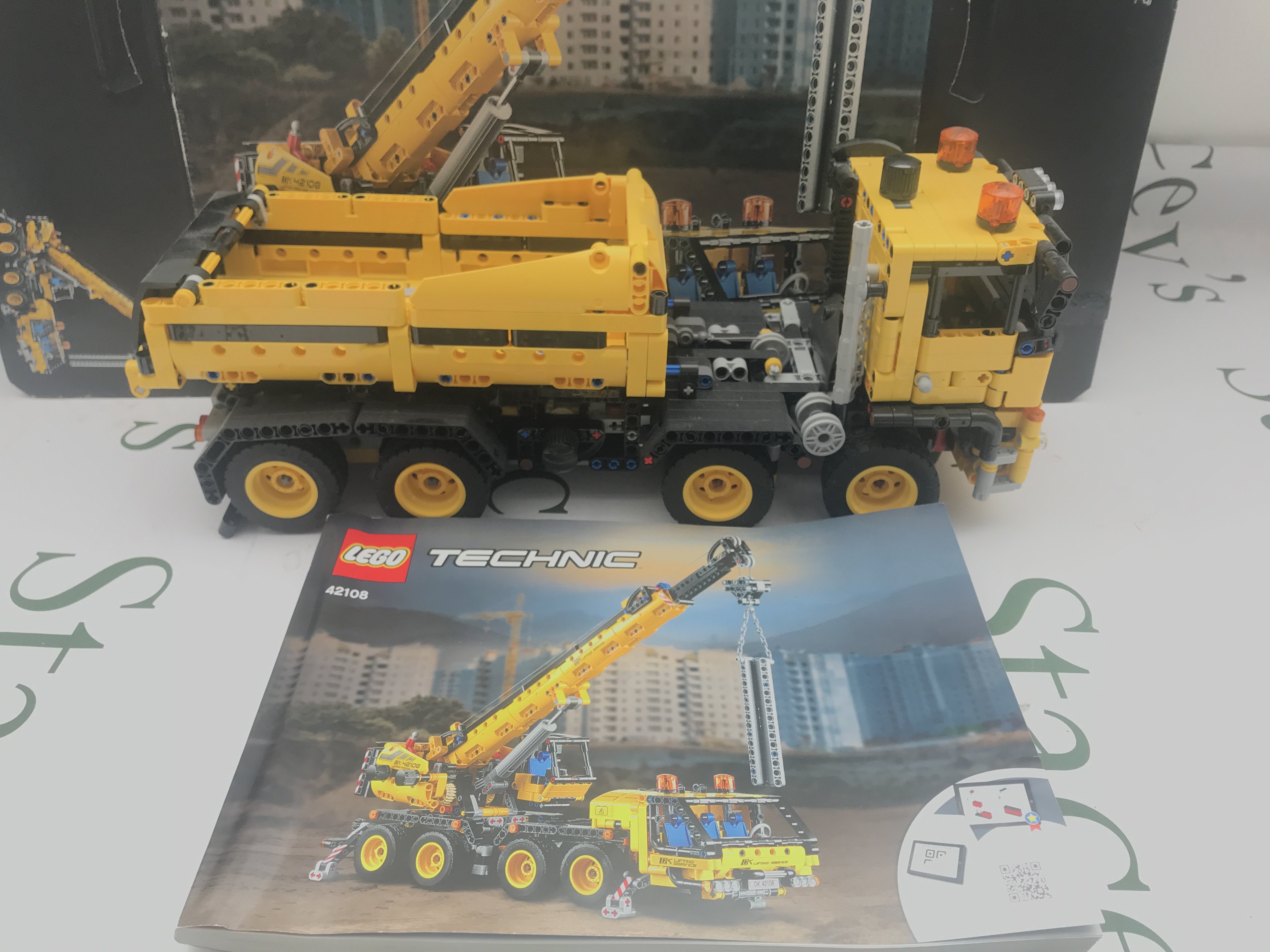 A Lego Mobile Crane Made Into A Truck. #42108 With Box And Manual this Lot Cannot Be Posted In House.