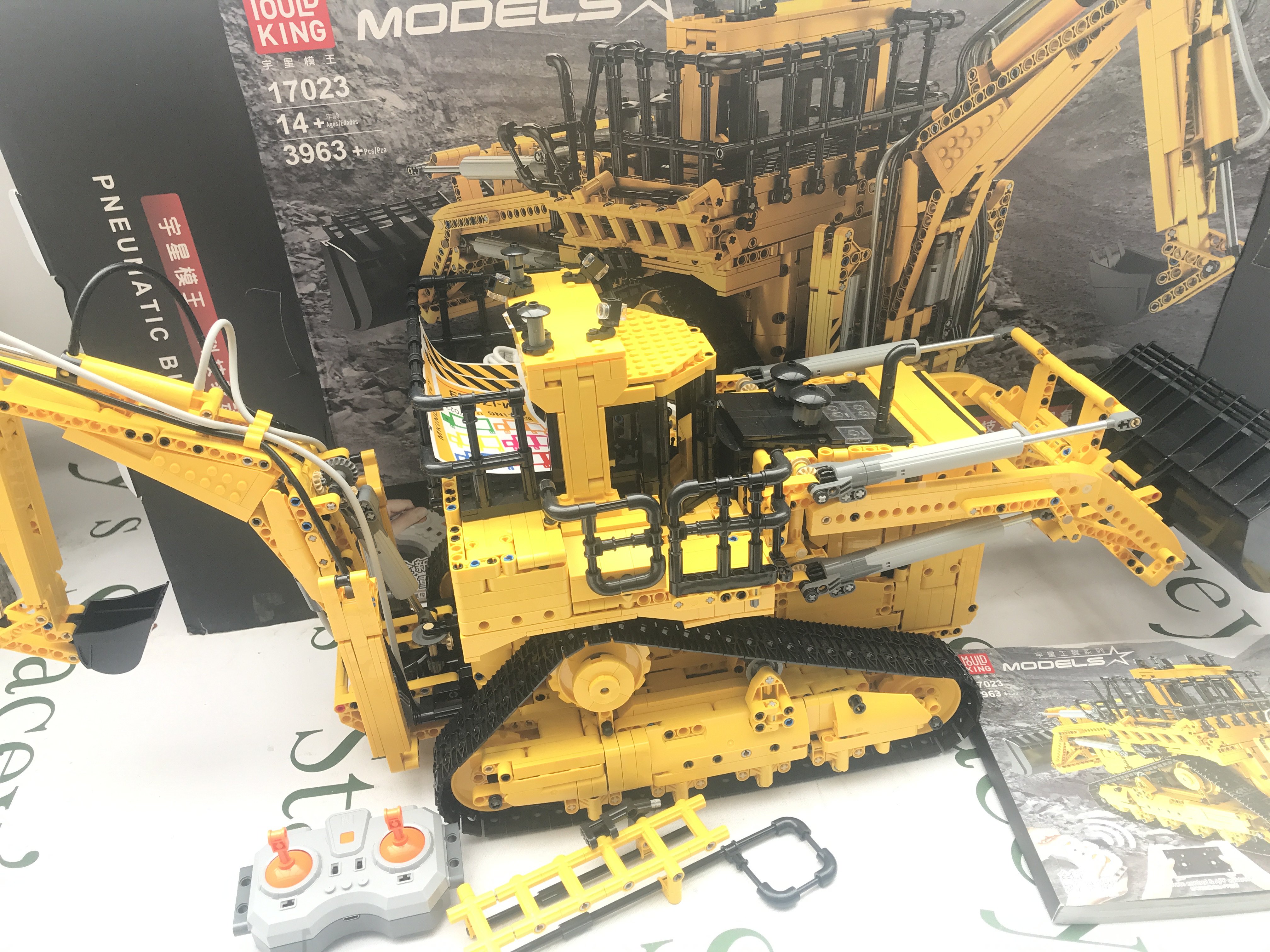 A Mould King R/C pneumatic Bulldozer With Black Hoe #17023. With Box And Manual. This Lot Cannot Be Posted In House.