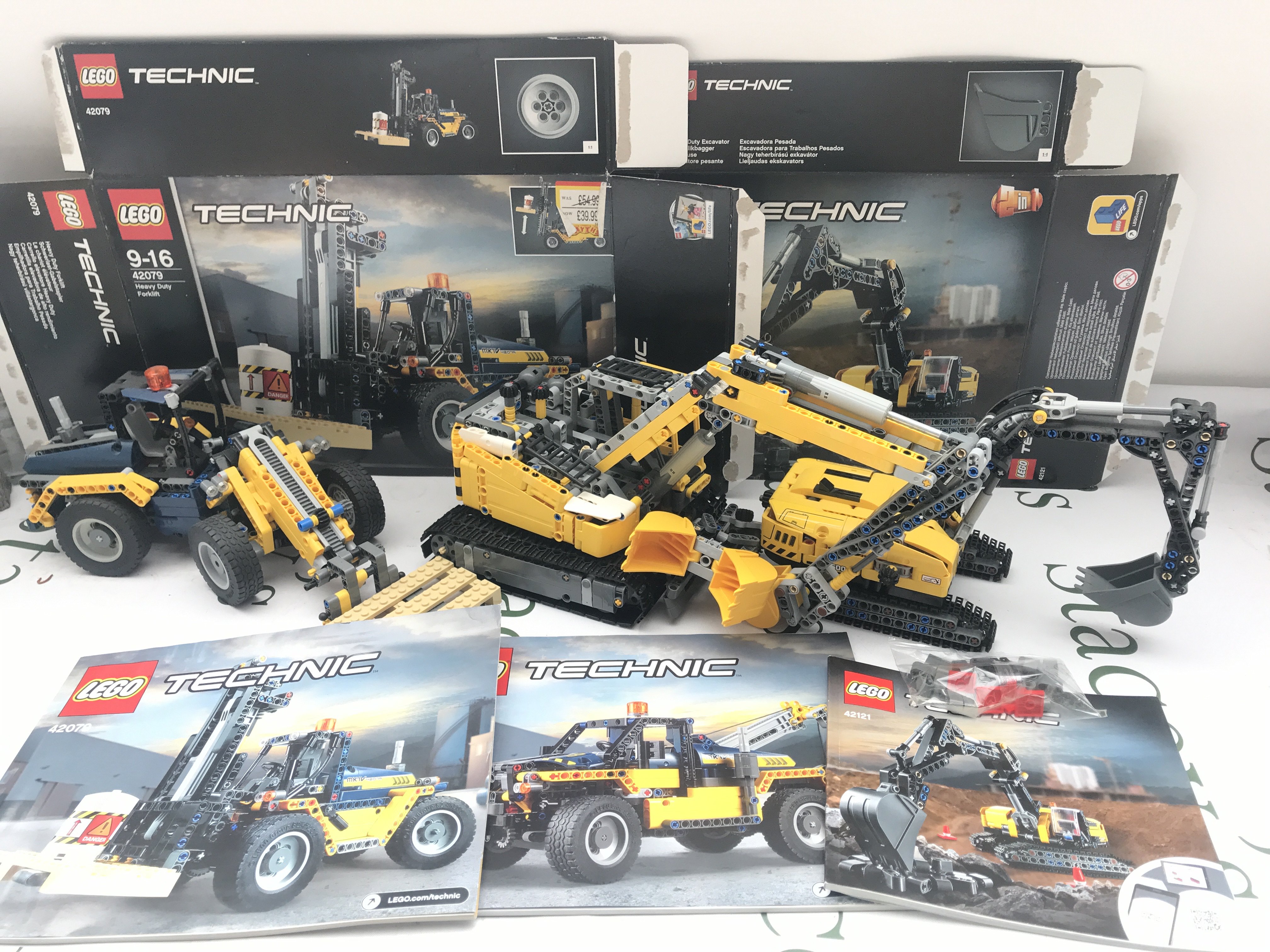 A Lego Heavy Duty Forklift (2 in one) #42079 And A Heavy Duty Excavator #42121.