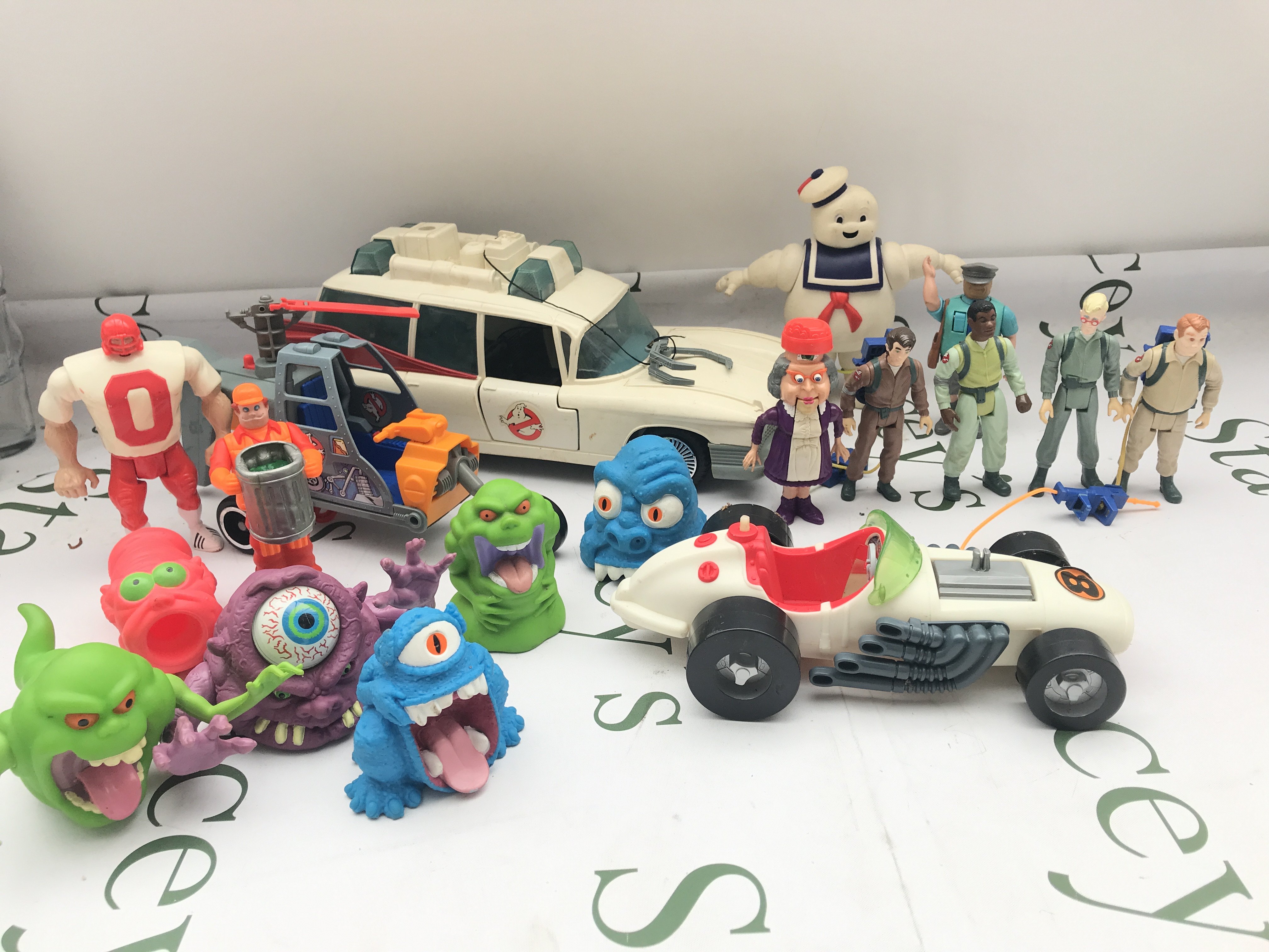 A Box Containing Vintage Ghostbusters Toys. Including Fire Station. No Reserve.