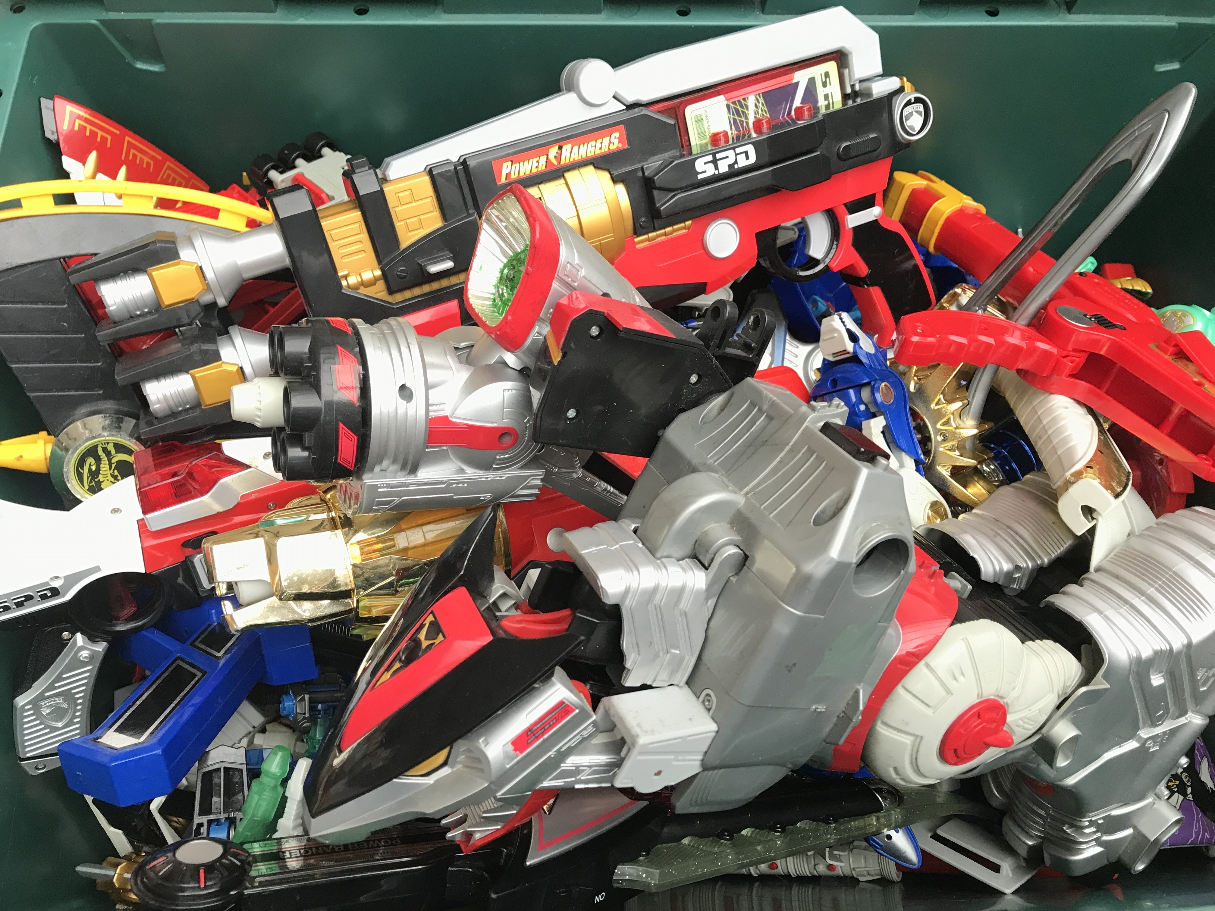 A Box Containing Playworn Power Rangers weapons. Megazords. Etc. No Reserve.