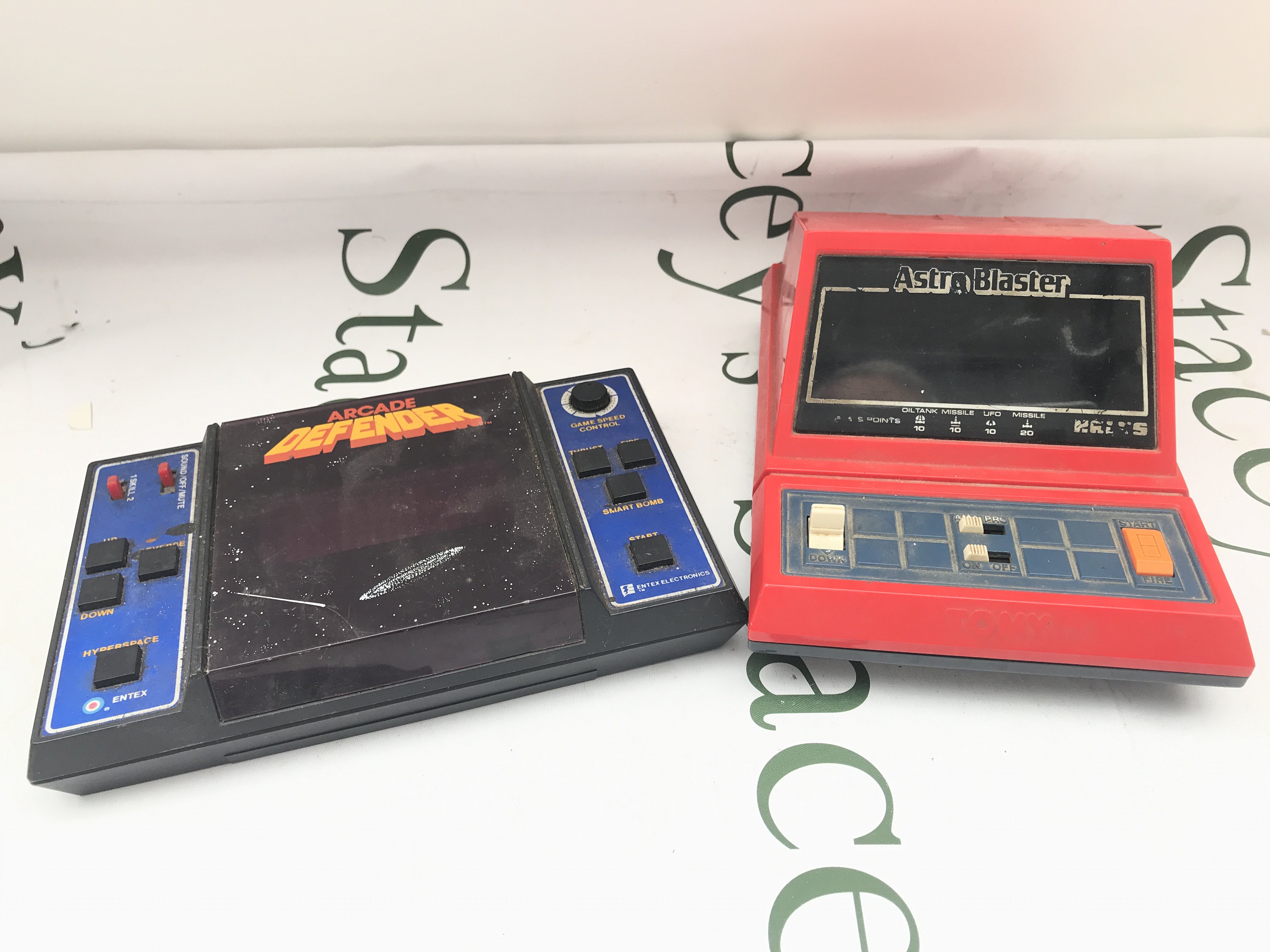 A Entex Electronics Defender And A Tomy Astro Blaster.