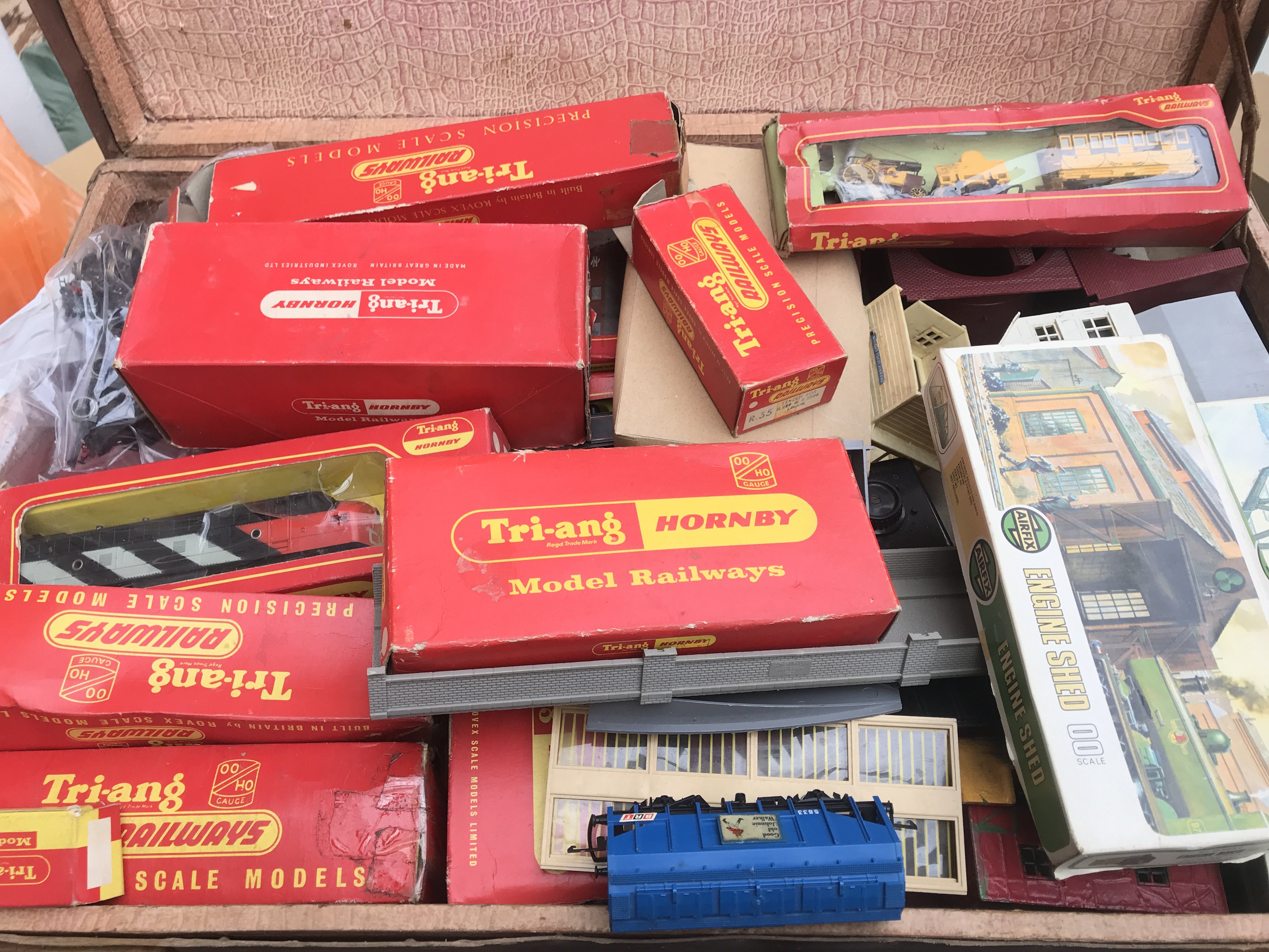 A Case Containing A Collection Of Hornby/Tri-Ang 00 Gauge Locos. Wagons. Buildings etc.(2)