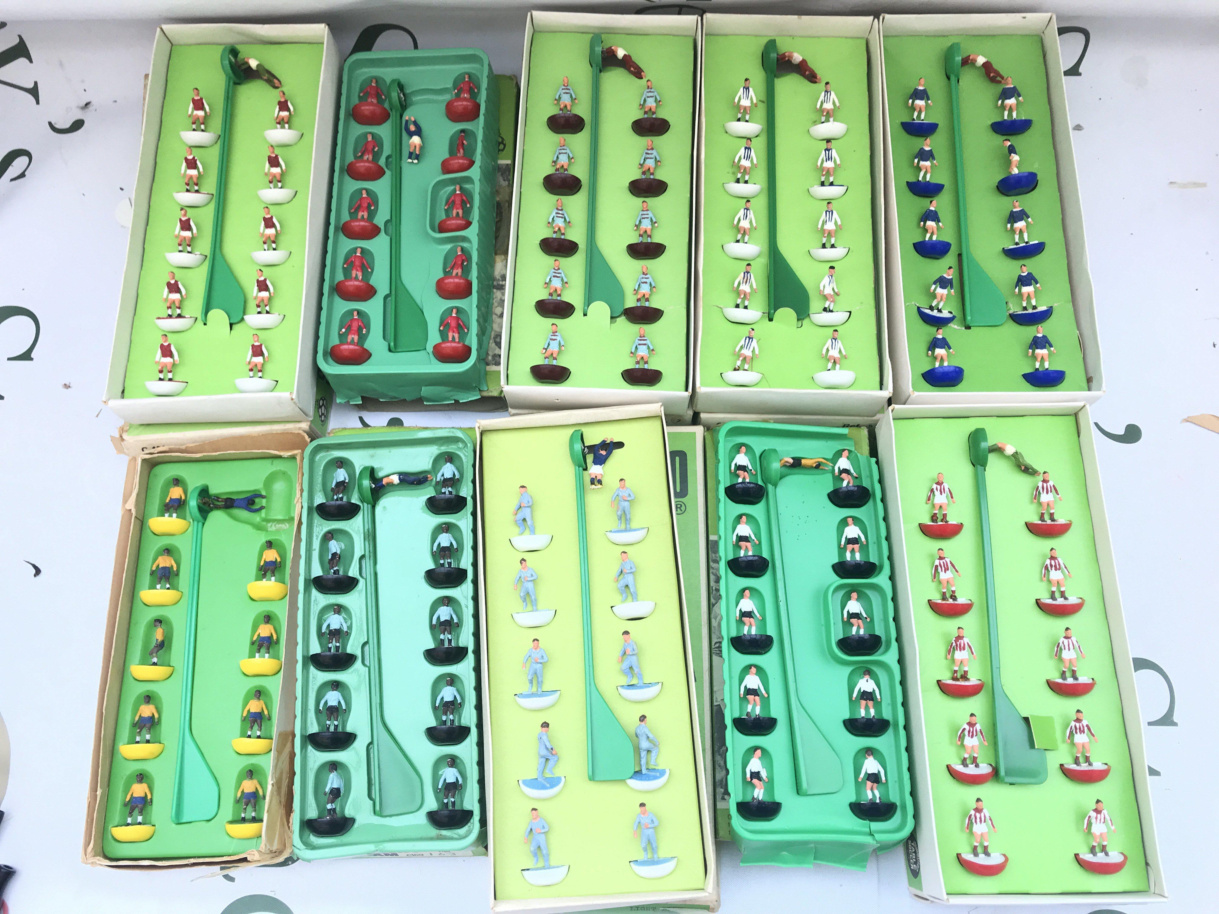 A Collection Of 23 Subbuteo Teams And Some Accessories and Pitch. (2).