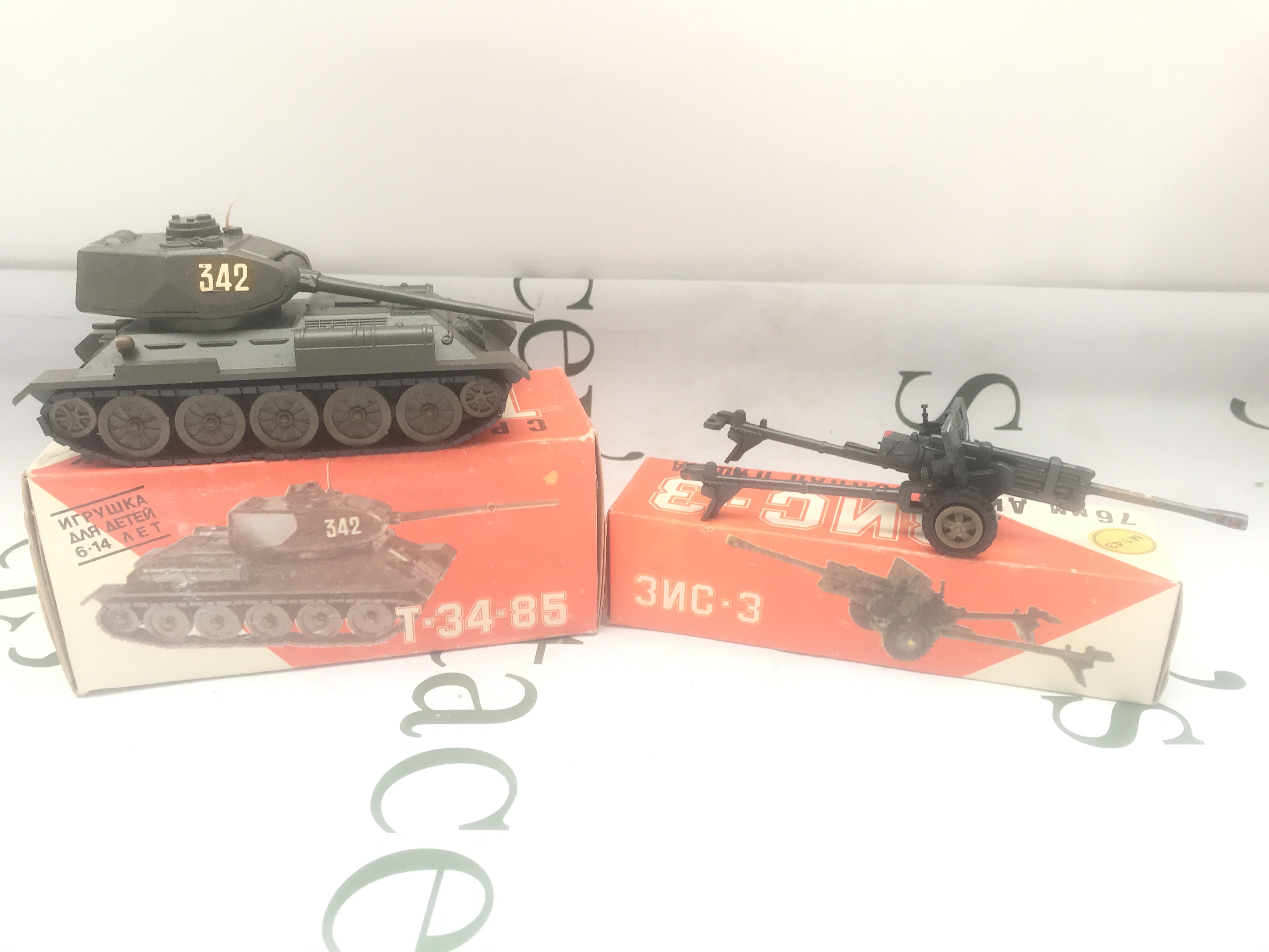 A Boxed USSR Military T-34-85 Tank. Field Gun And A Armoured Car A/F 1/43 Scale.