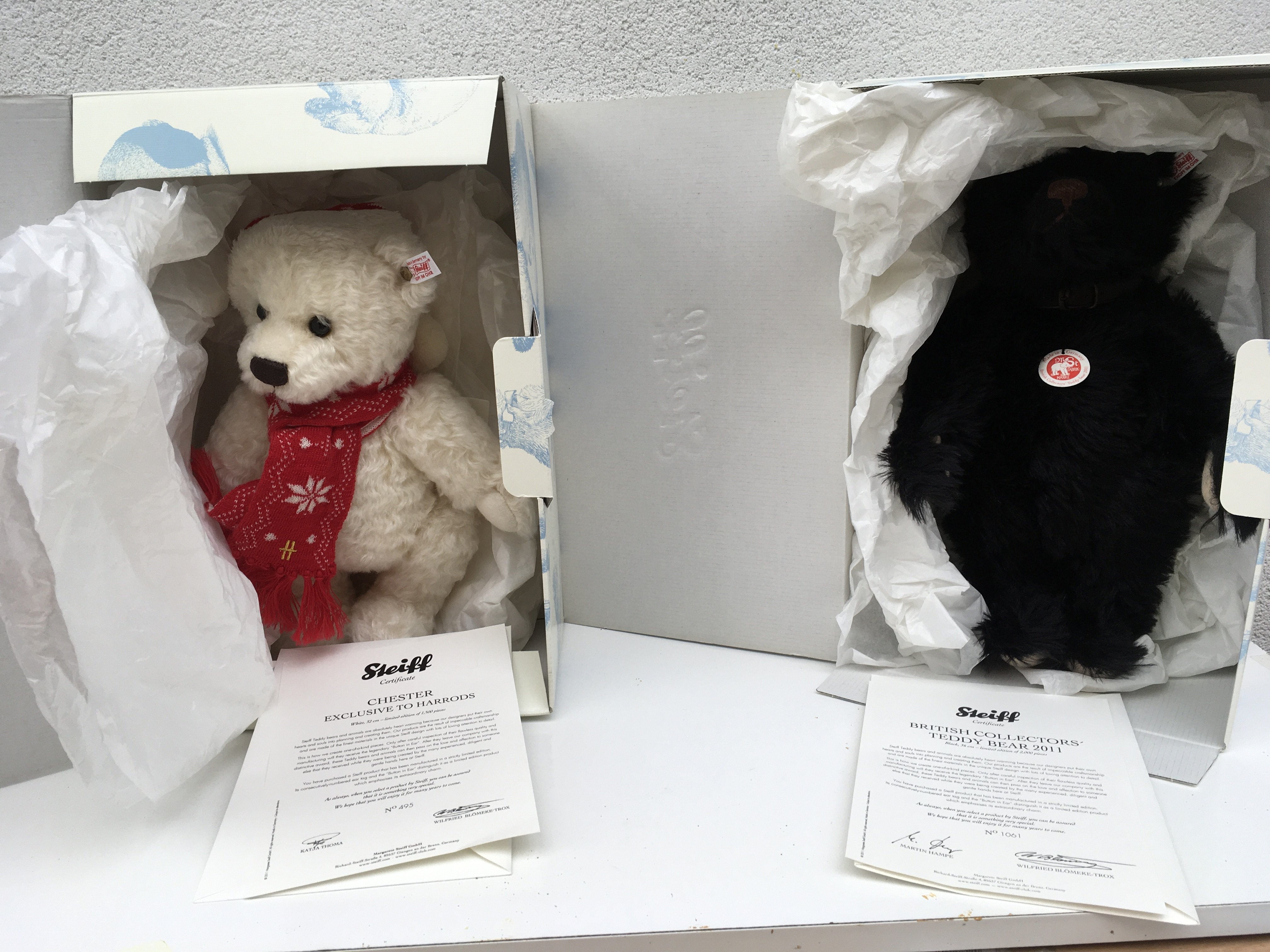 A pair of boxed limited edition Steiff teddy bears each with COA features Chester (32cms) 495 of 1500 and 2011 Black Bear (36cms) 1061 of 2000. Both featuring the Button in Ear and growler. No reserve. (2)