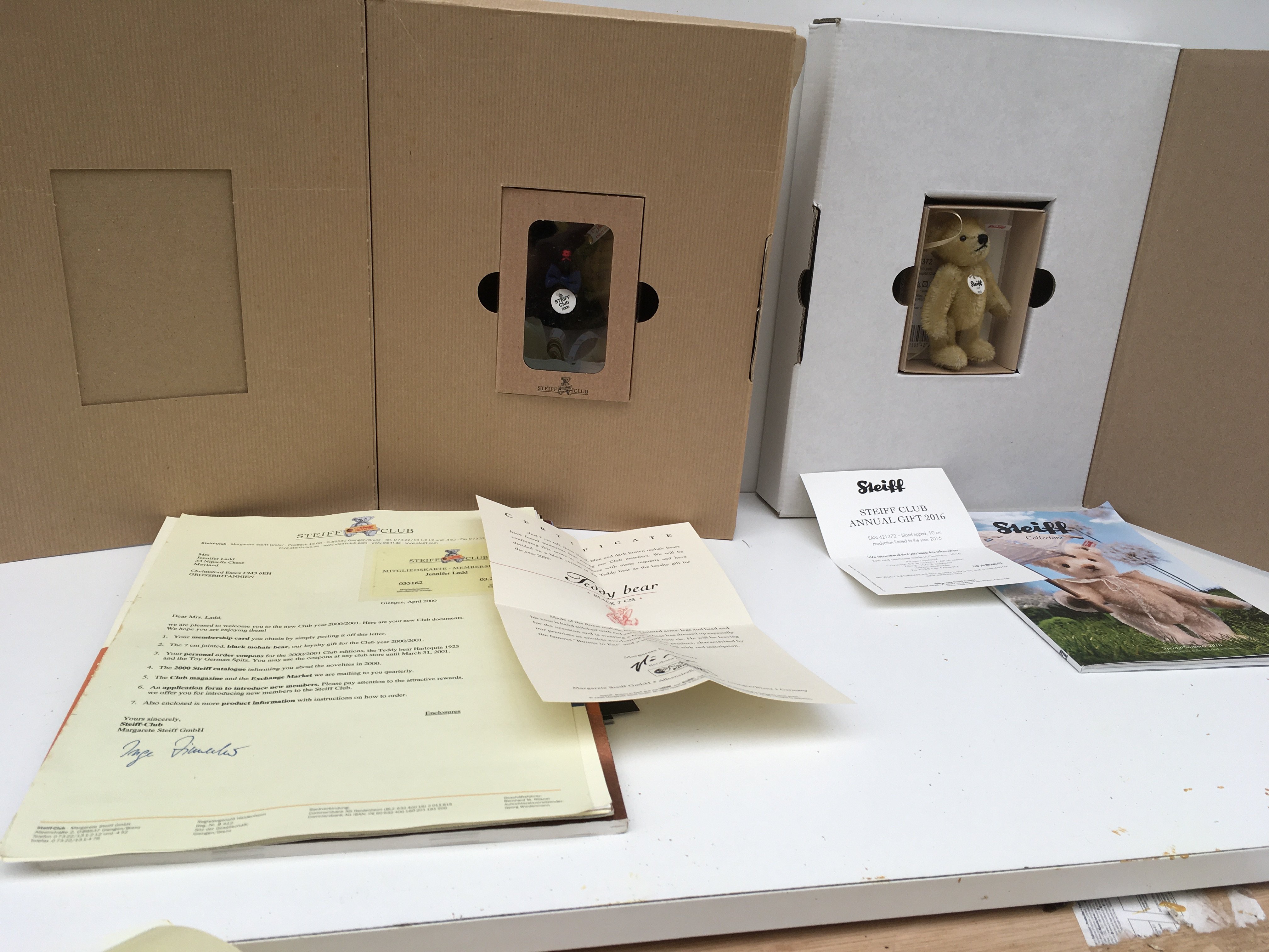 Two boxed Steiff minature teddy bears produced as annual gifts to Steiff Club members. Featuring a 7cms black mohair bear for 2000 and a 10cms blond tipped bear for 2016. Both with certificates and other paperwork. No reserve. (2)
