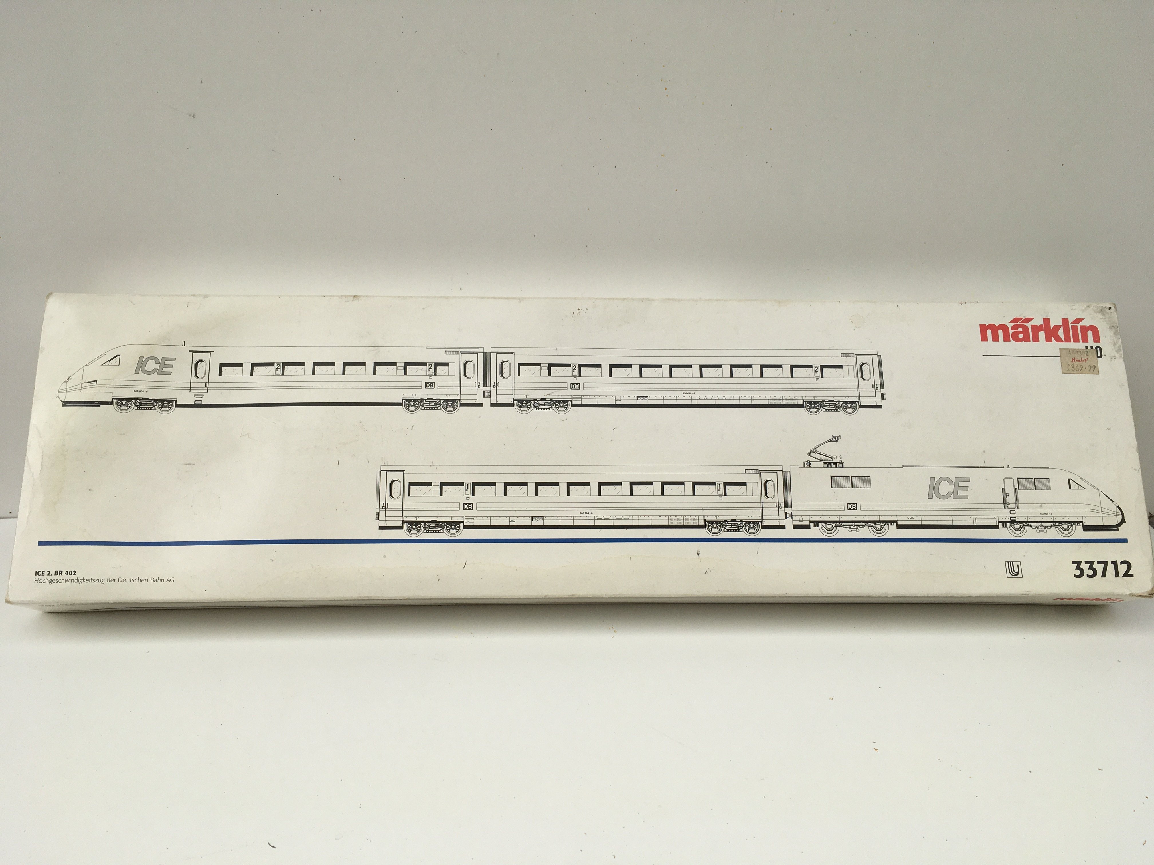 A boxed Marklin model railway set contains 2 locomotives with coaches HO gauge. Includes instructional leaflets. Set no. 33712. No reserve