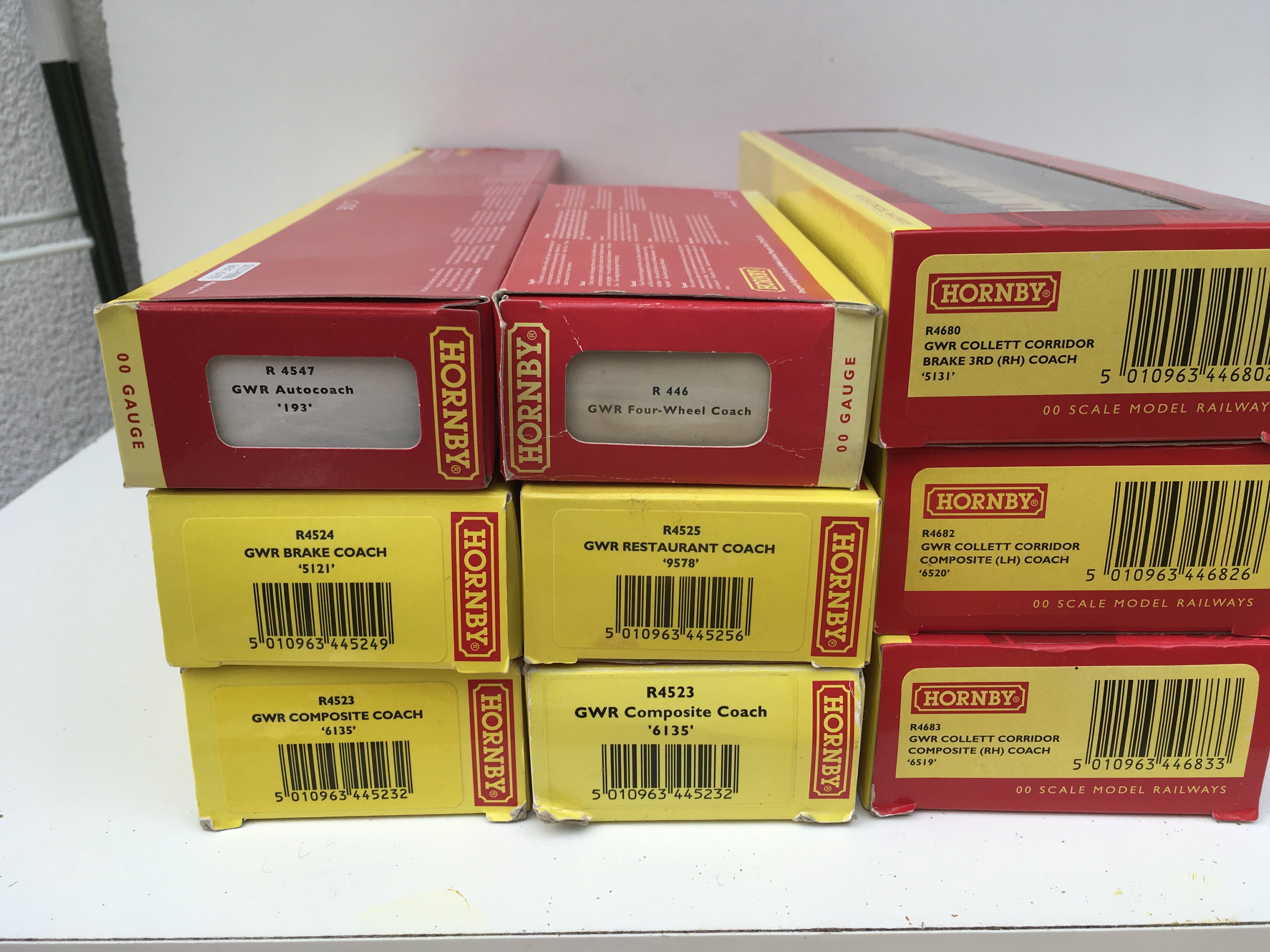 A collection of 9 boxed Hornby 00gauge model railway coaches. No reserve.