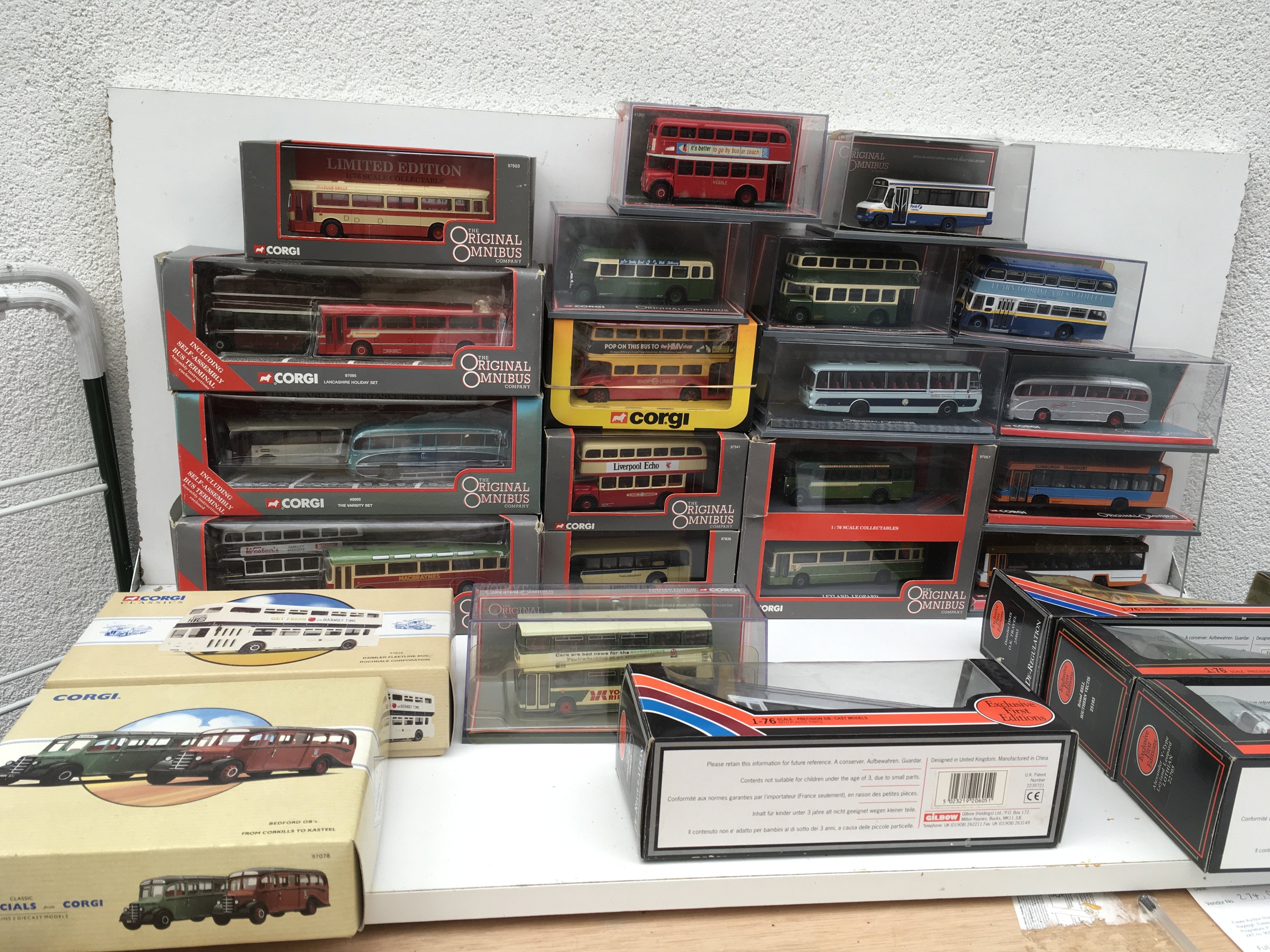 A collection of 25 boxed diecast model vehicles by Corgi and EFE featuring buses. Some limited edition with certificates. No reserve