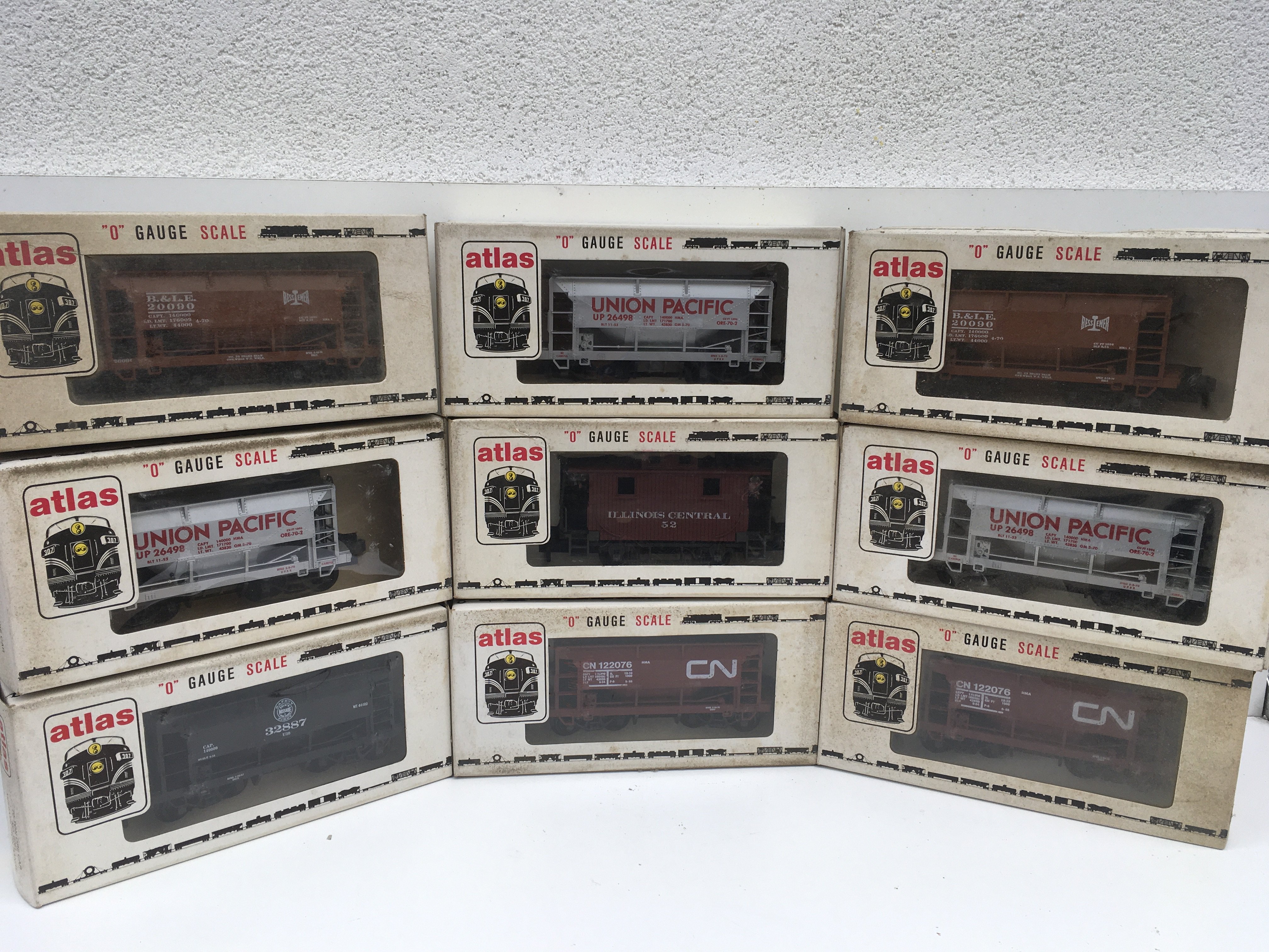 A collection of 9 boxed O gauge rolling stock wagons by atlas. No reserve