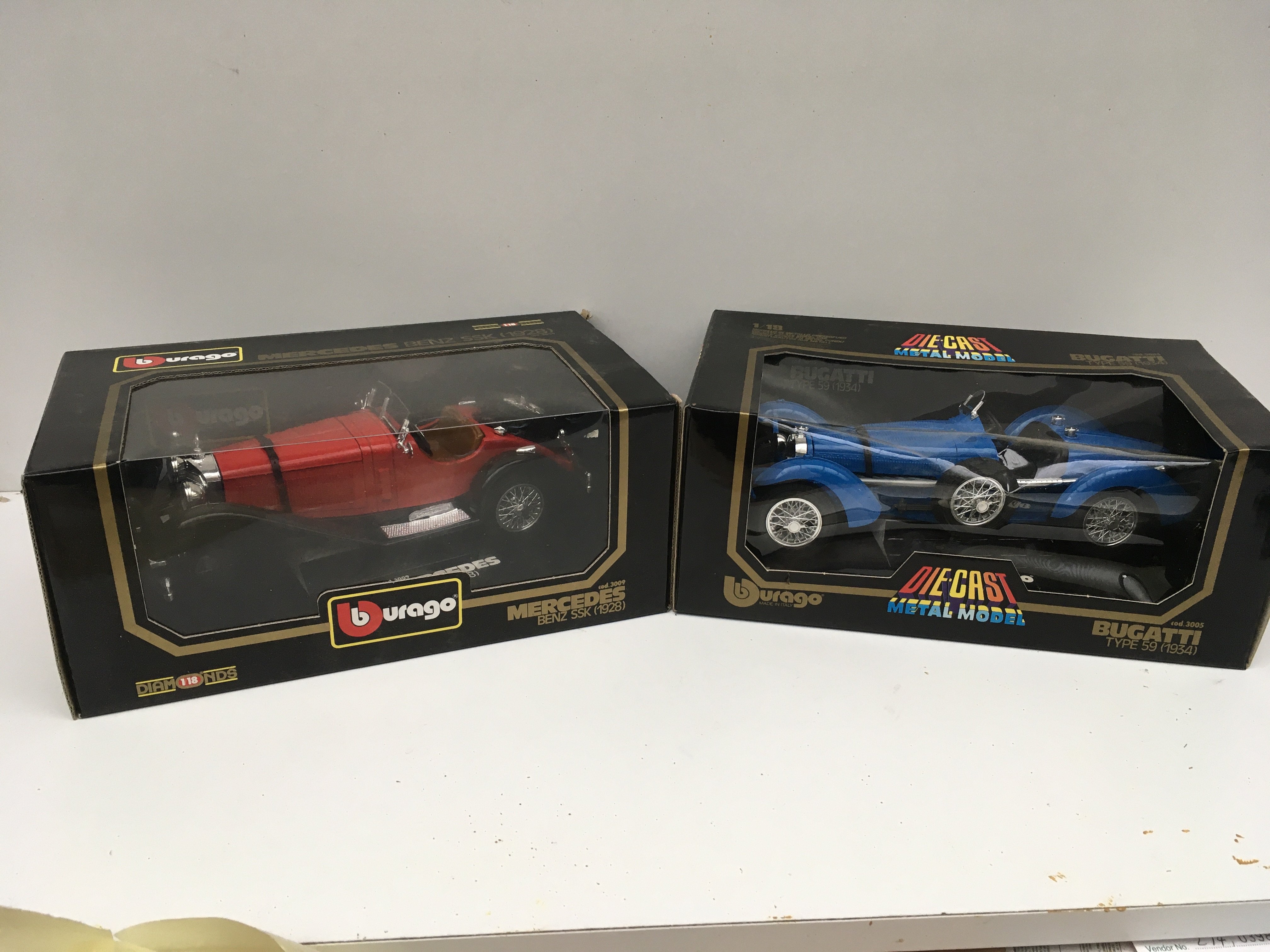 2x boxed diecast model cars by burago featuring a 1928 Mercedes Benz SSK and a 1934 Bugatti type 59. No reserve.