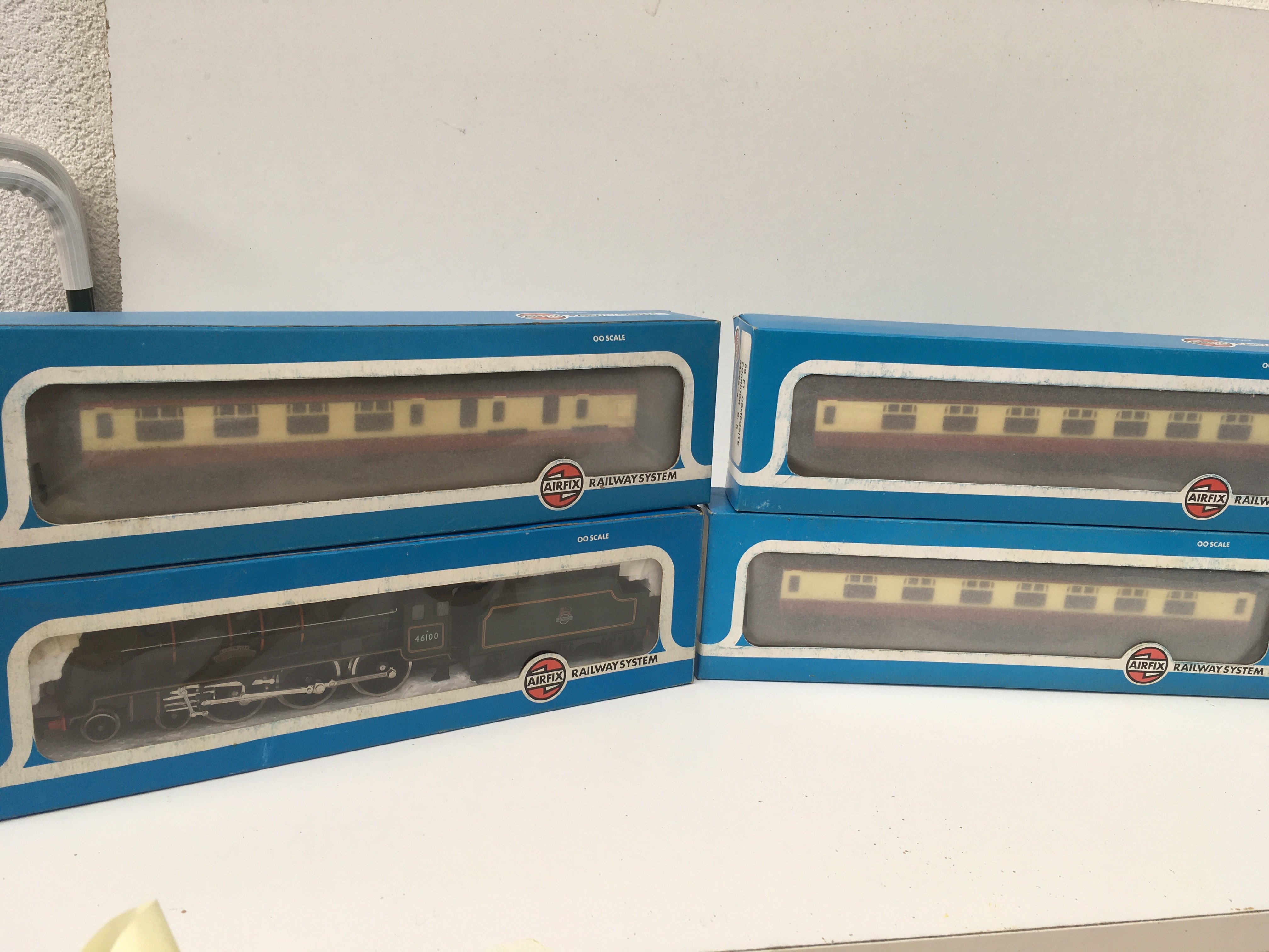 Boxed OO gauge model railway pieces by Airfix featuring a locomotive and tender Royal Scot and 3x coaches. No reserve