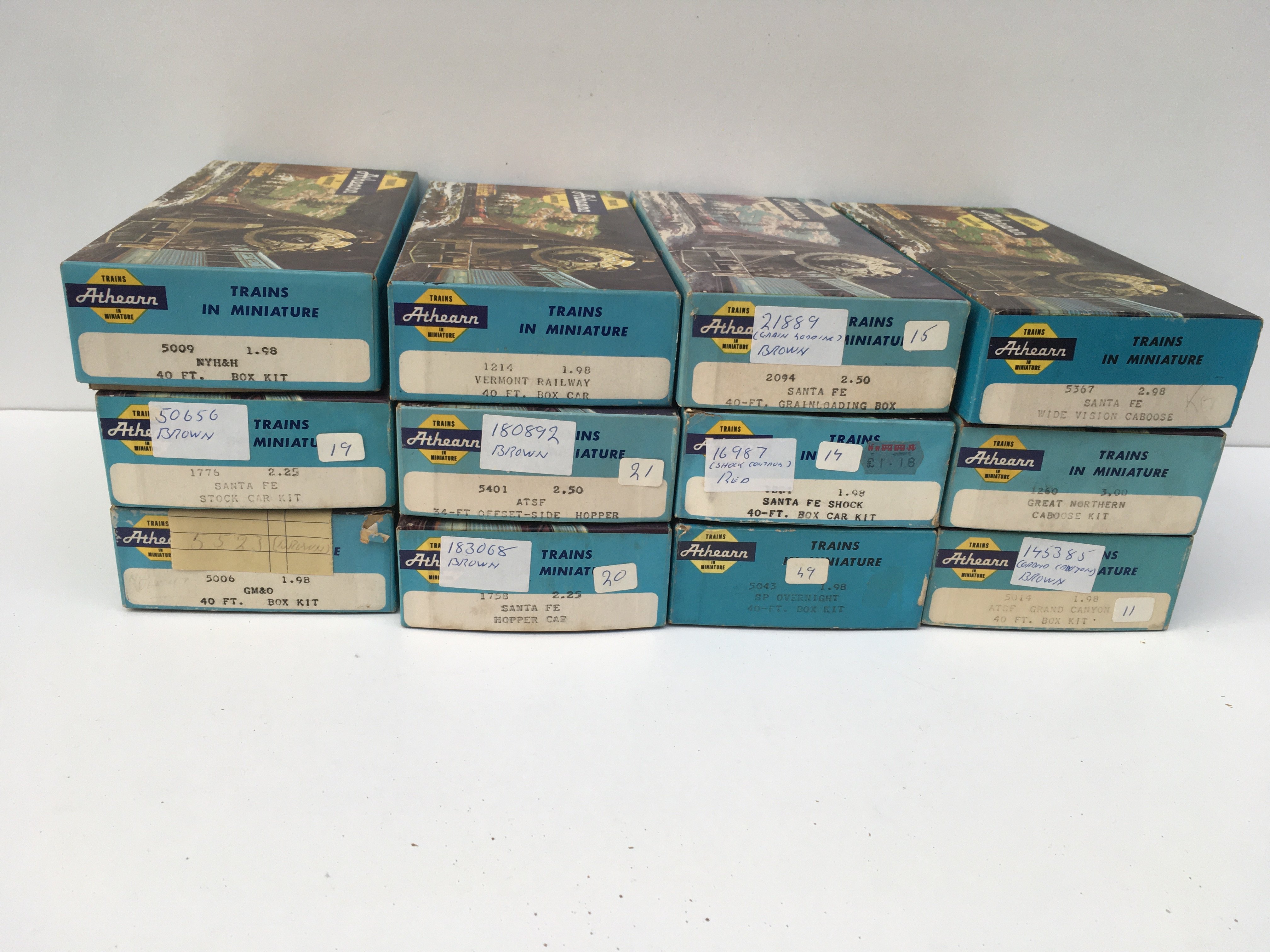 A collection of 12 boxed HO gauge model railway wagons by Athearn. No reserve