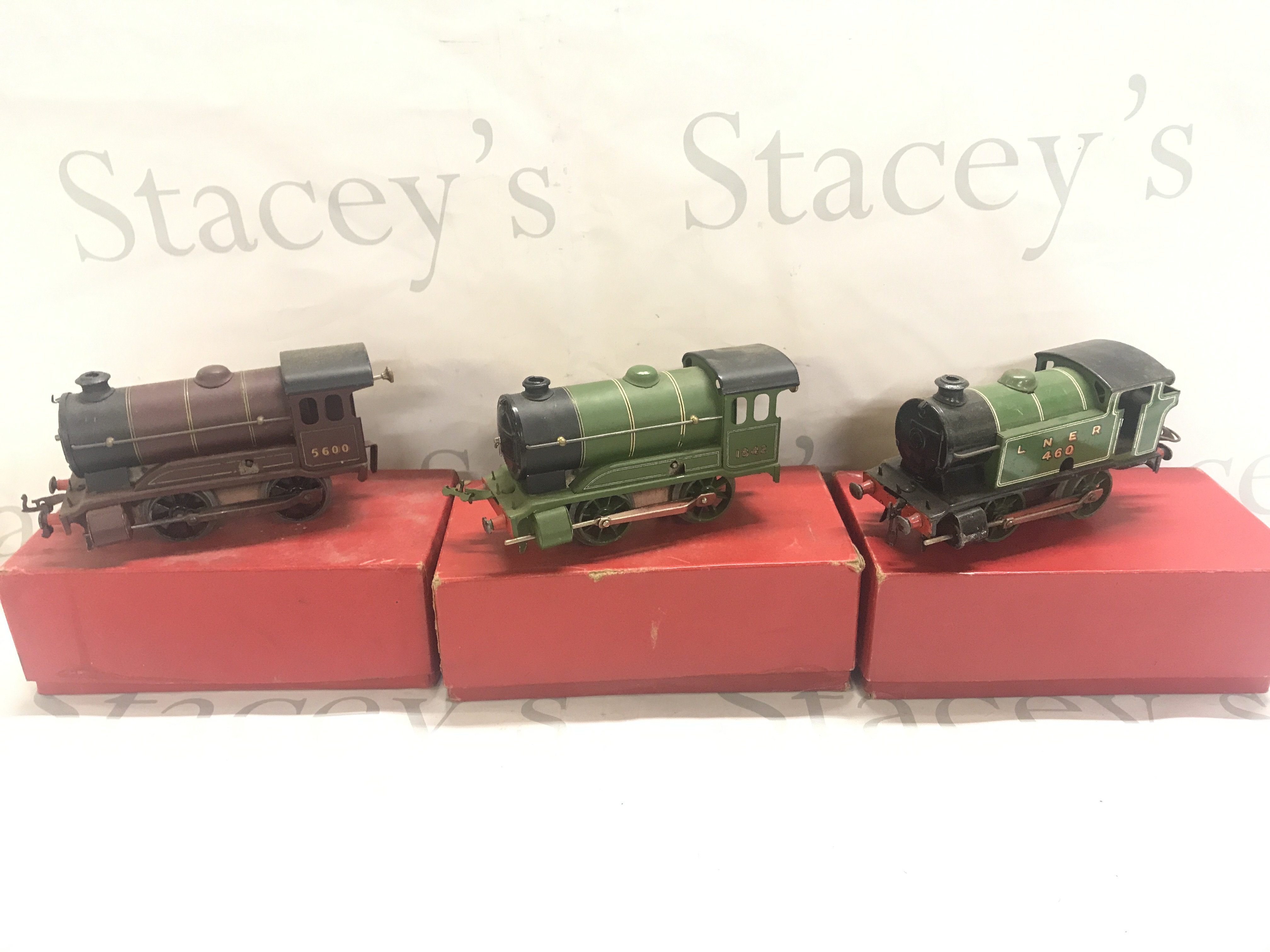 A Collection Of Boxed 0 Gauge Including 3 Locos. Wagons And Accessories. Some Loose And Track.(5).