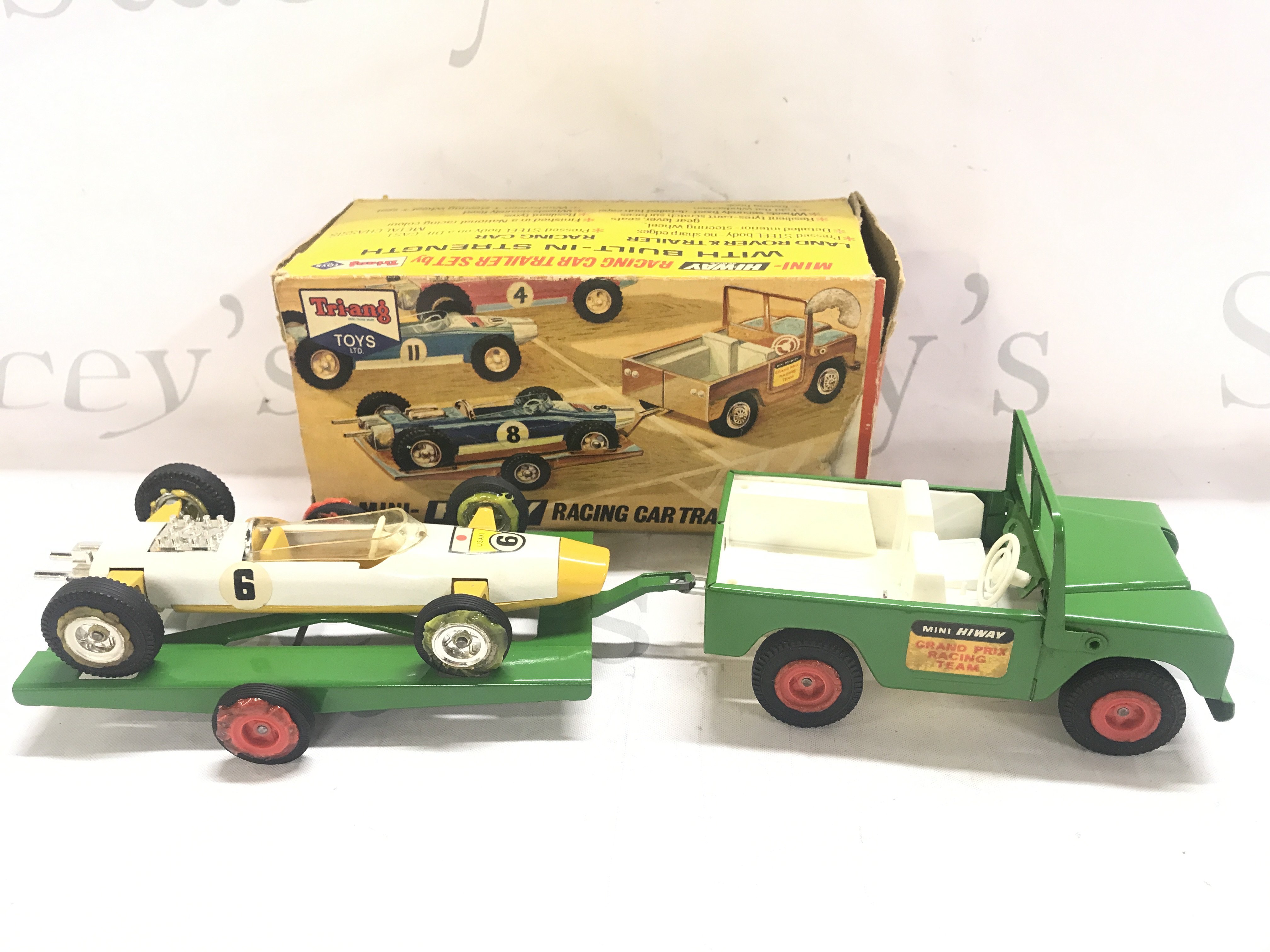 A Boxed Tri-Ang Mini-Hi-Way Racing Car And Trailer set. Box Is Worn.