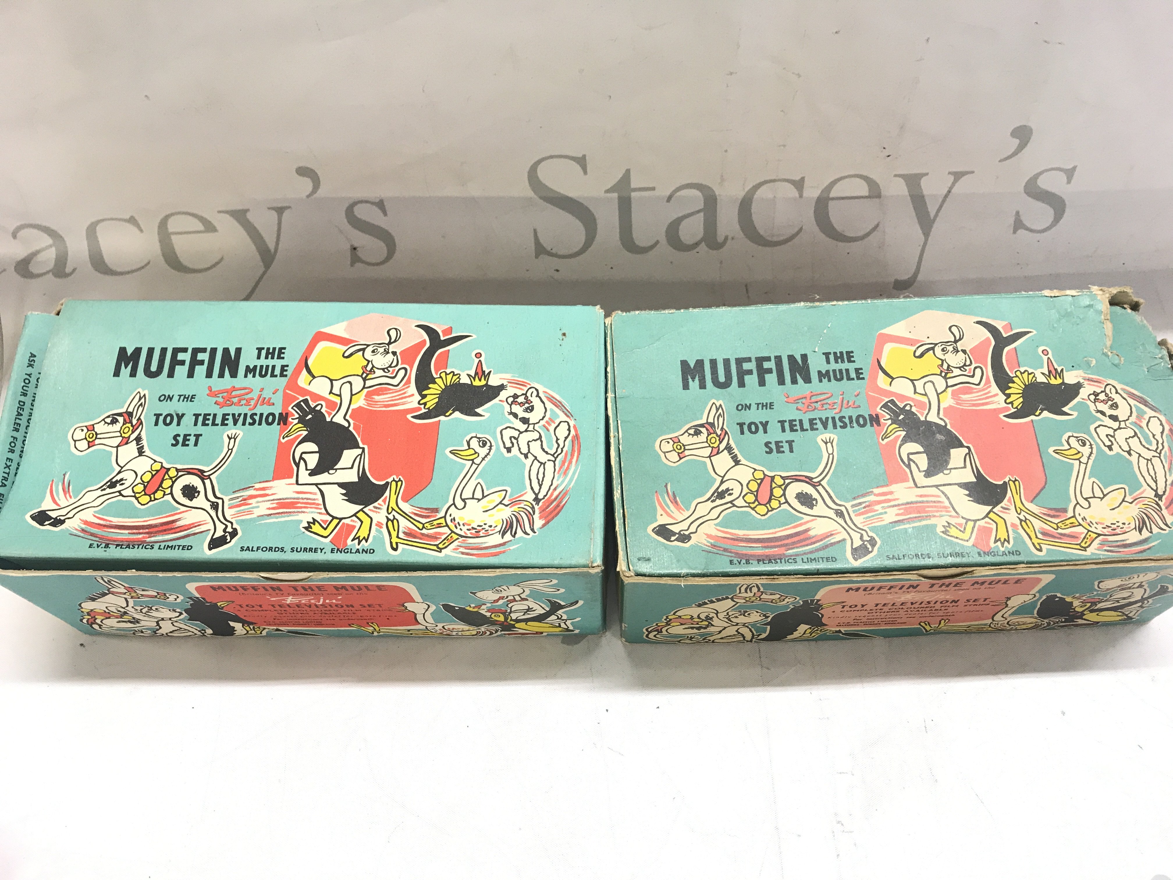 2 Boxed Muffin TheMule Toy Television Sets.