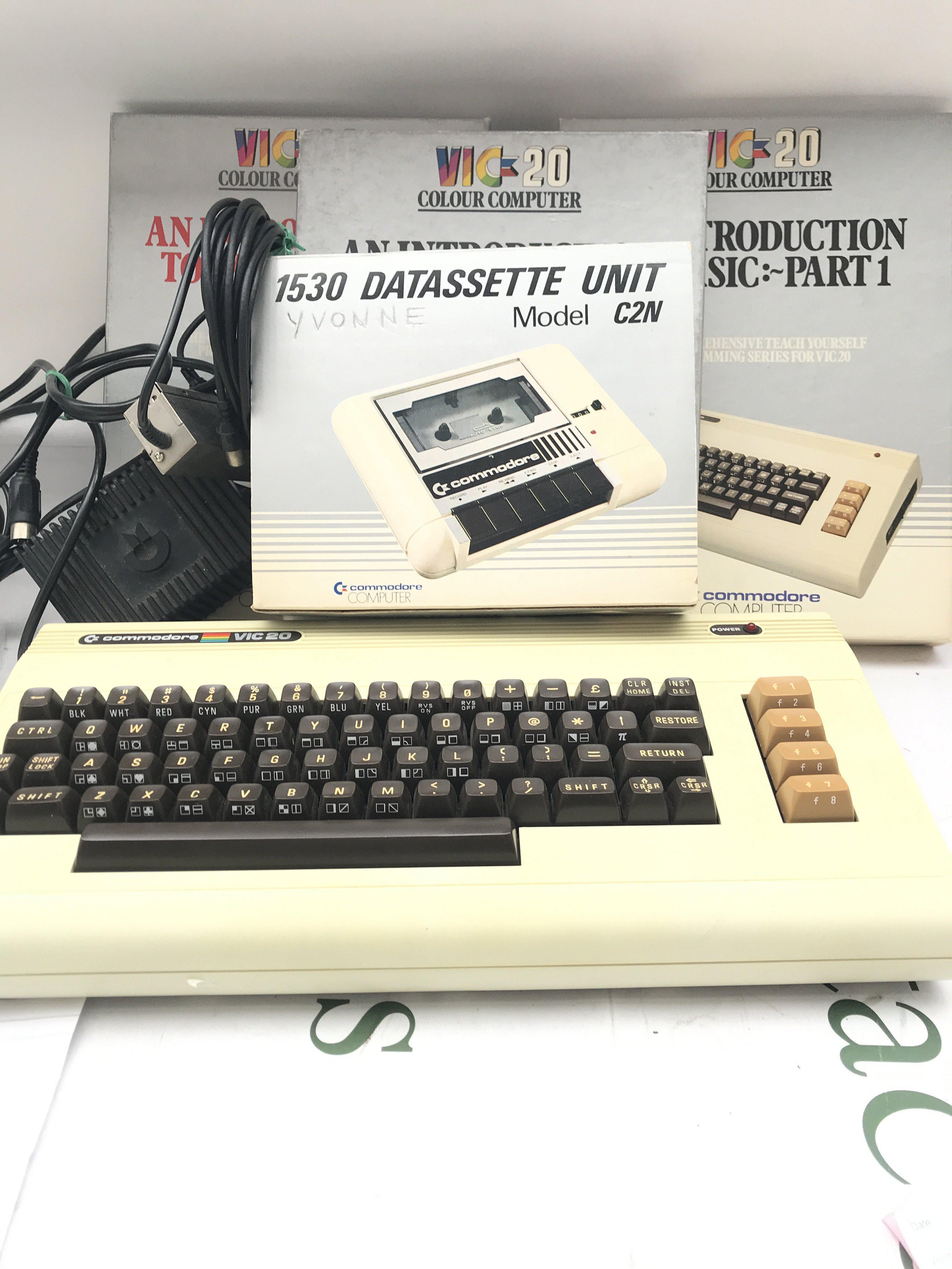 A Commodore Vic 20 With Leads. A Boxed Tape Deck And Introductions.