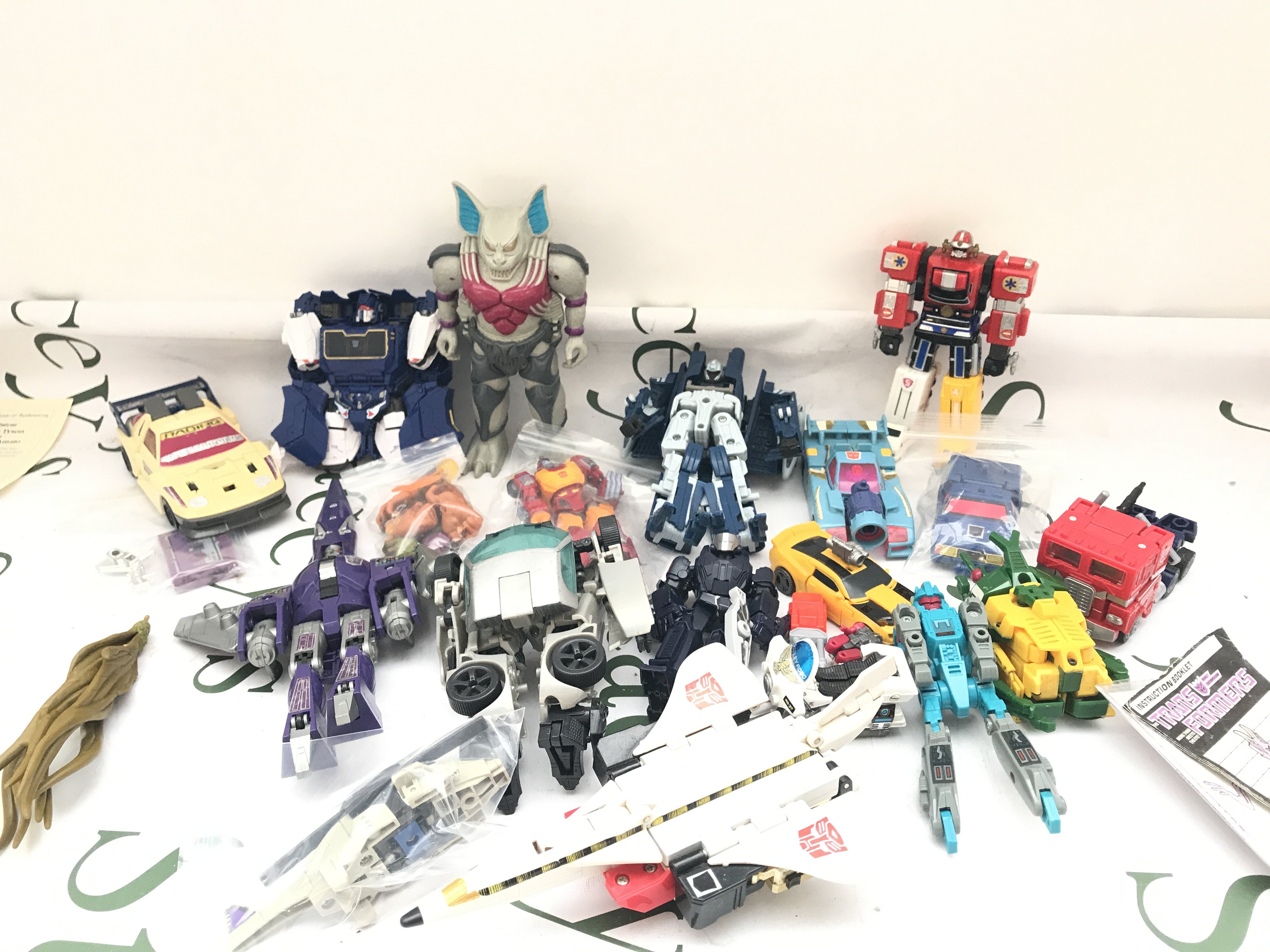 A Box Containing Transformer Toys Ideal For Spare Parts Etc.