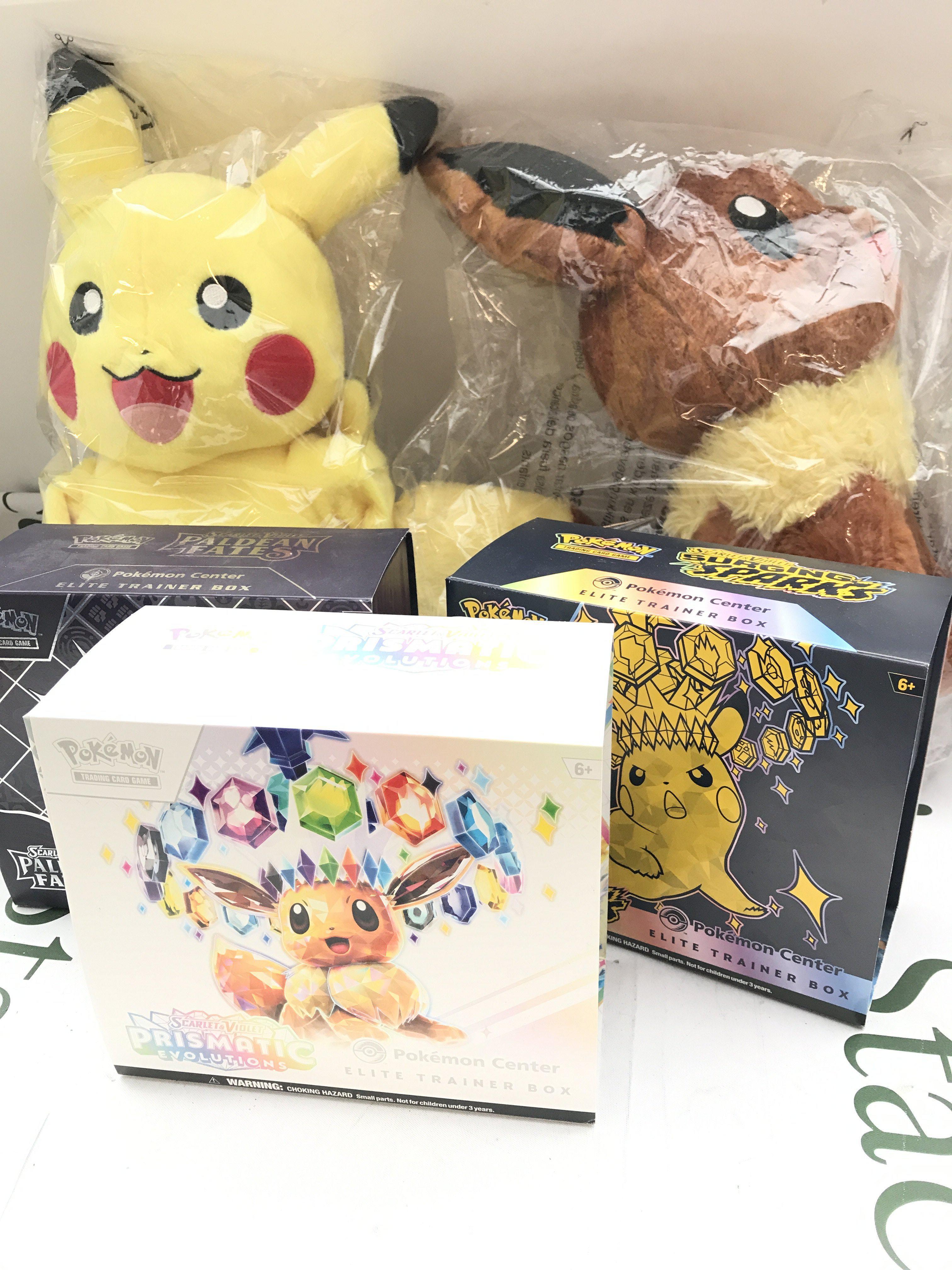 A Collection of Pokemon Cards Also 2 Soft Toys And 3 Empty Boxes. No Reserve.