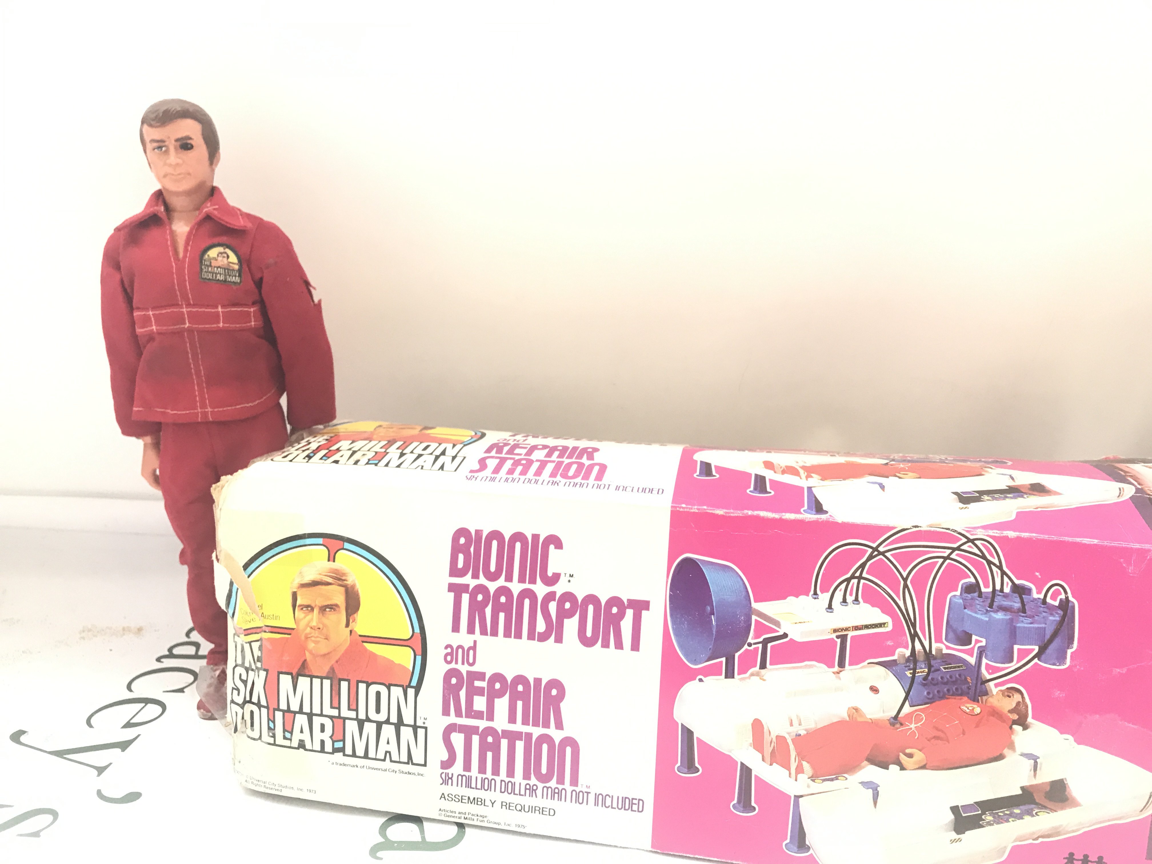 A Six Million Dollar Man Figure And A Boxed Bionic Transport And Repair Station. Box Is Worn. No Reserve.