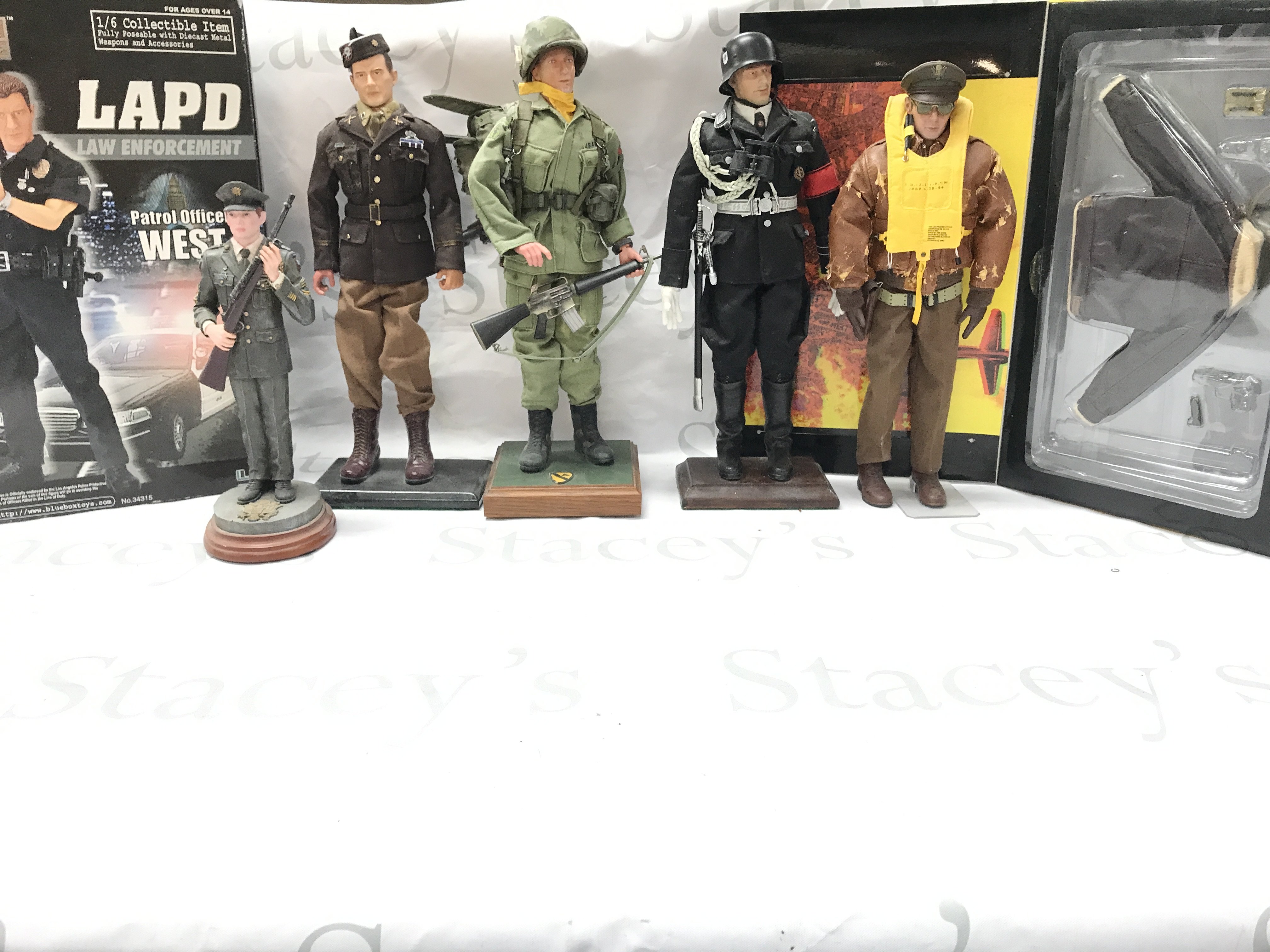 A Collection Of Dragon Models soldiers Mounted On To A Base. Pilot Comes With Box. And A Boxed Elite Force LAPD Patrol Officer.