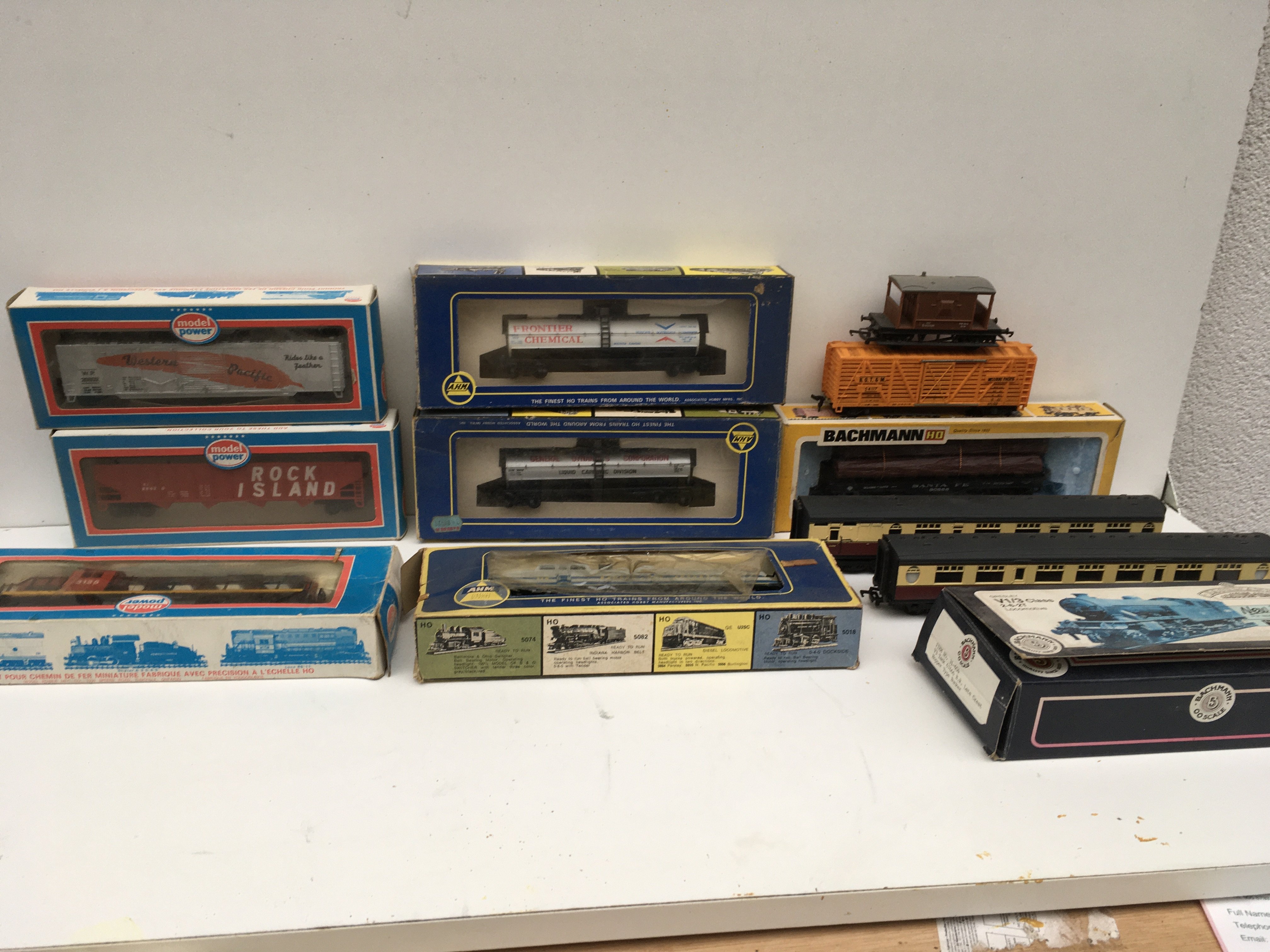 A collection of model railway accessories HO and OO gauge. Features 3 boxed locomotives by Bachmann..AHM and Model Power plus 9x rolling stock by the same manufacturers mostly boxed. No reserve