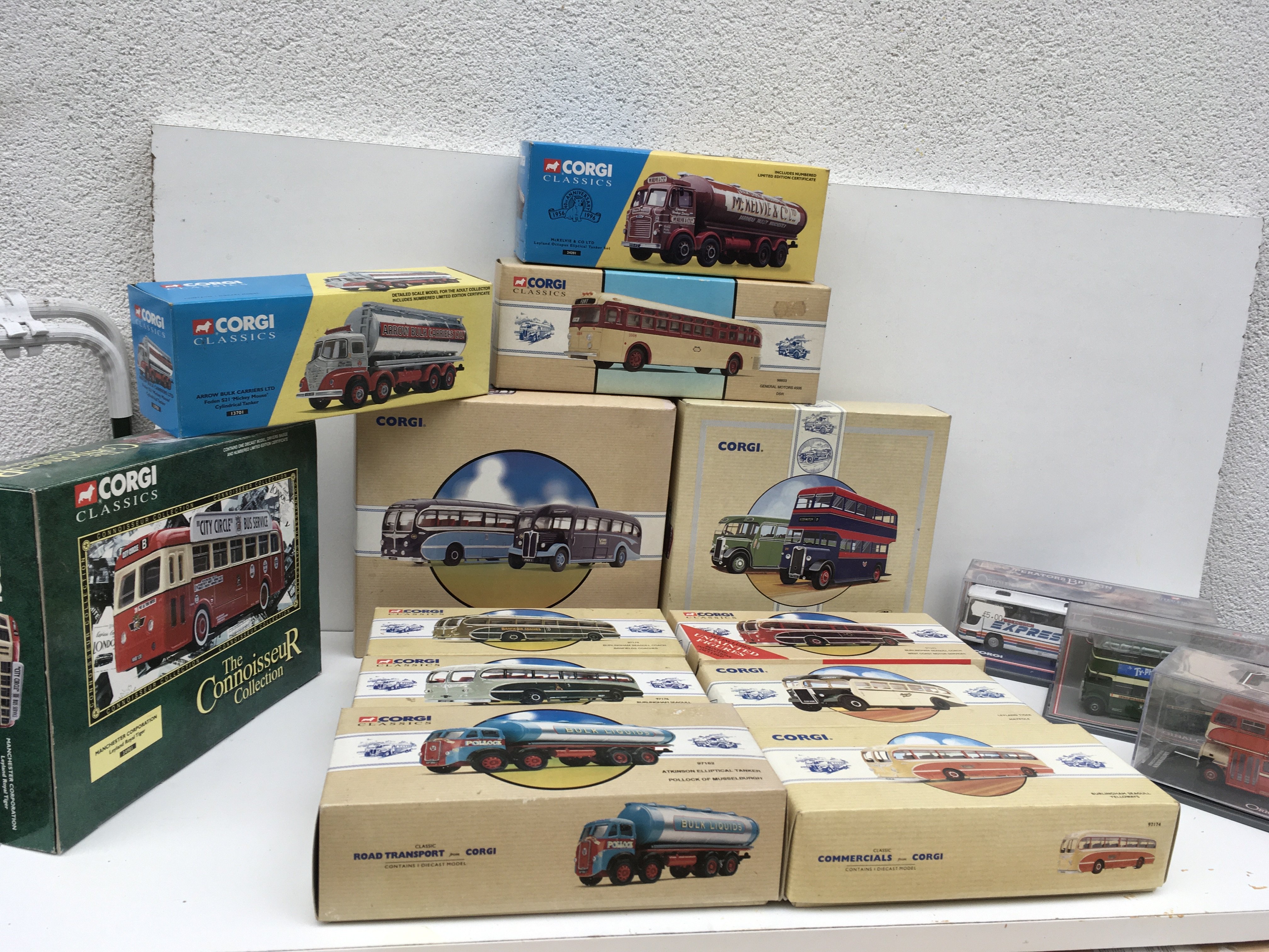 A collection of 15 boxed Corgi model diecast vehicles mostly buses or coaches plus 3 tankers. No reserve