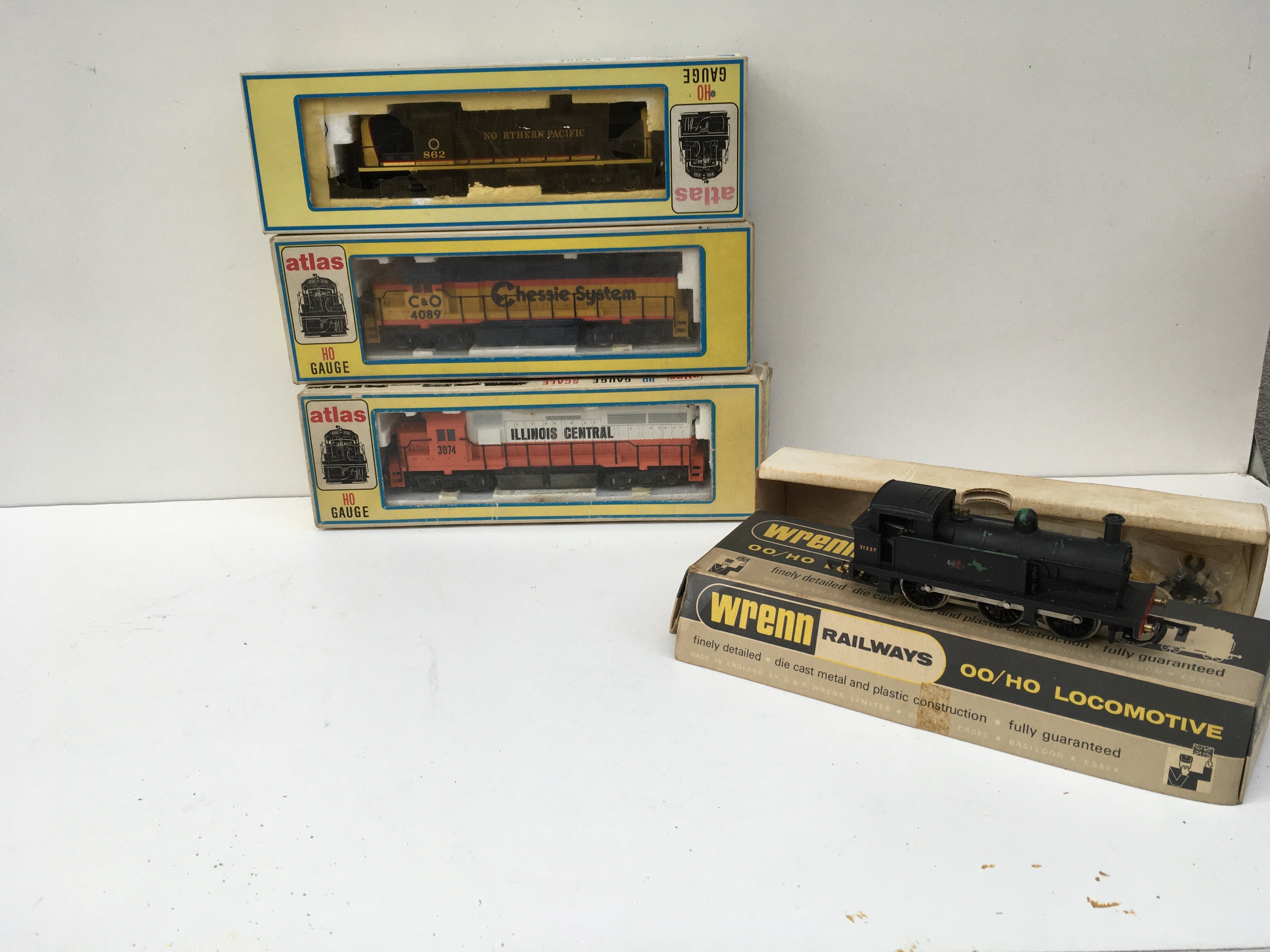 A group of 4 boxed locomotives HO..OO gauge. 3 x atlas and 1 x Wren. No reserve