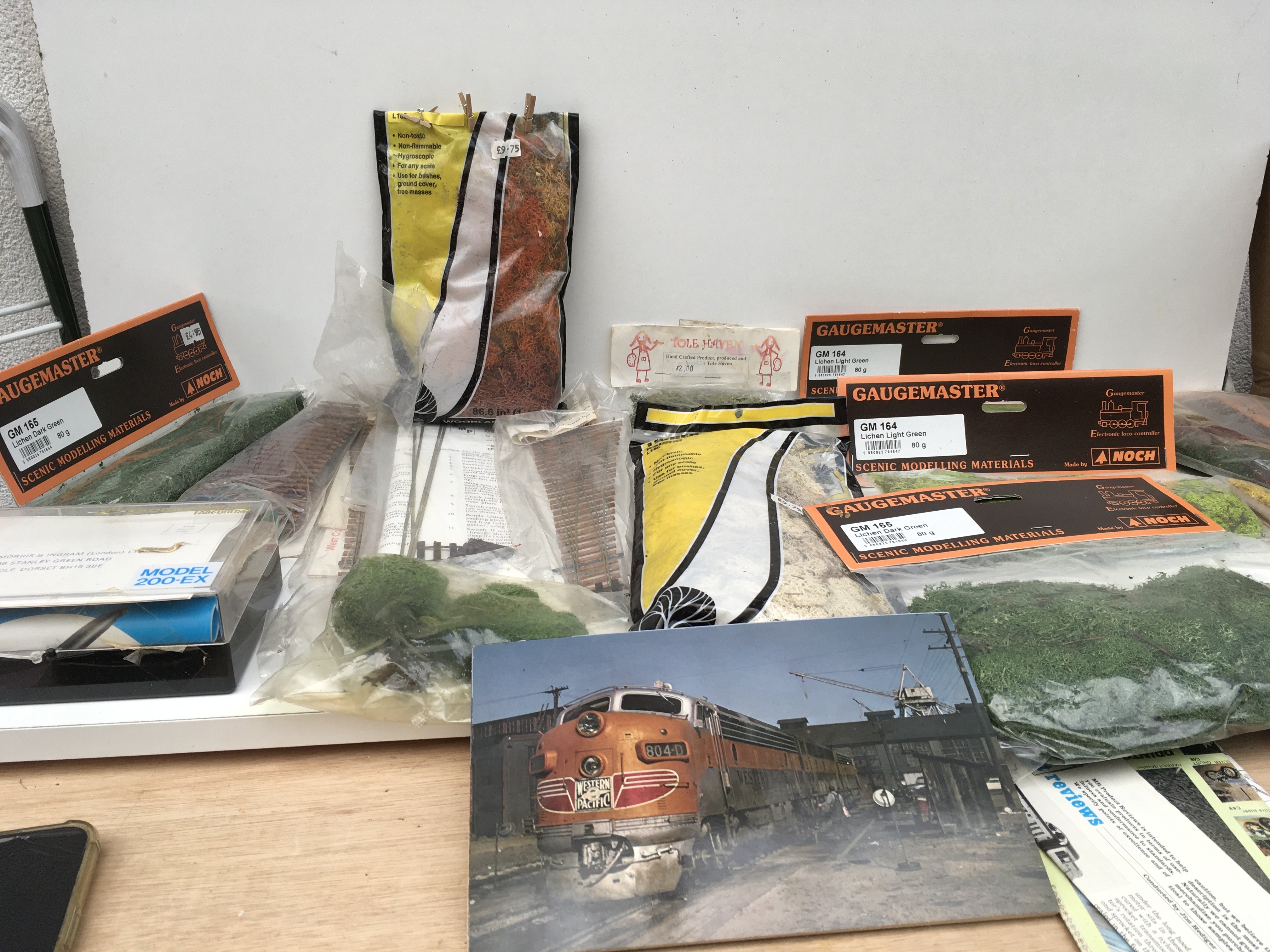 A collection of model railway accessories including track..scenery..picture cards and Air brush set. No reserve.