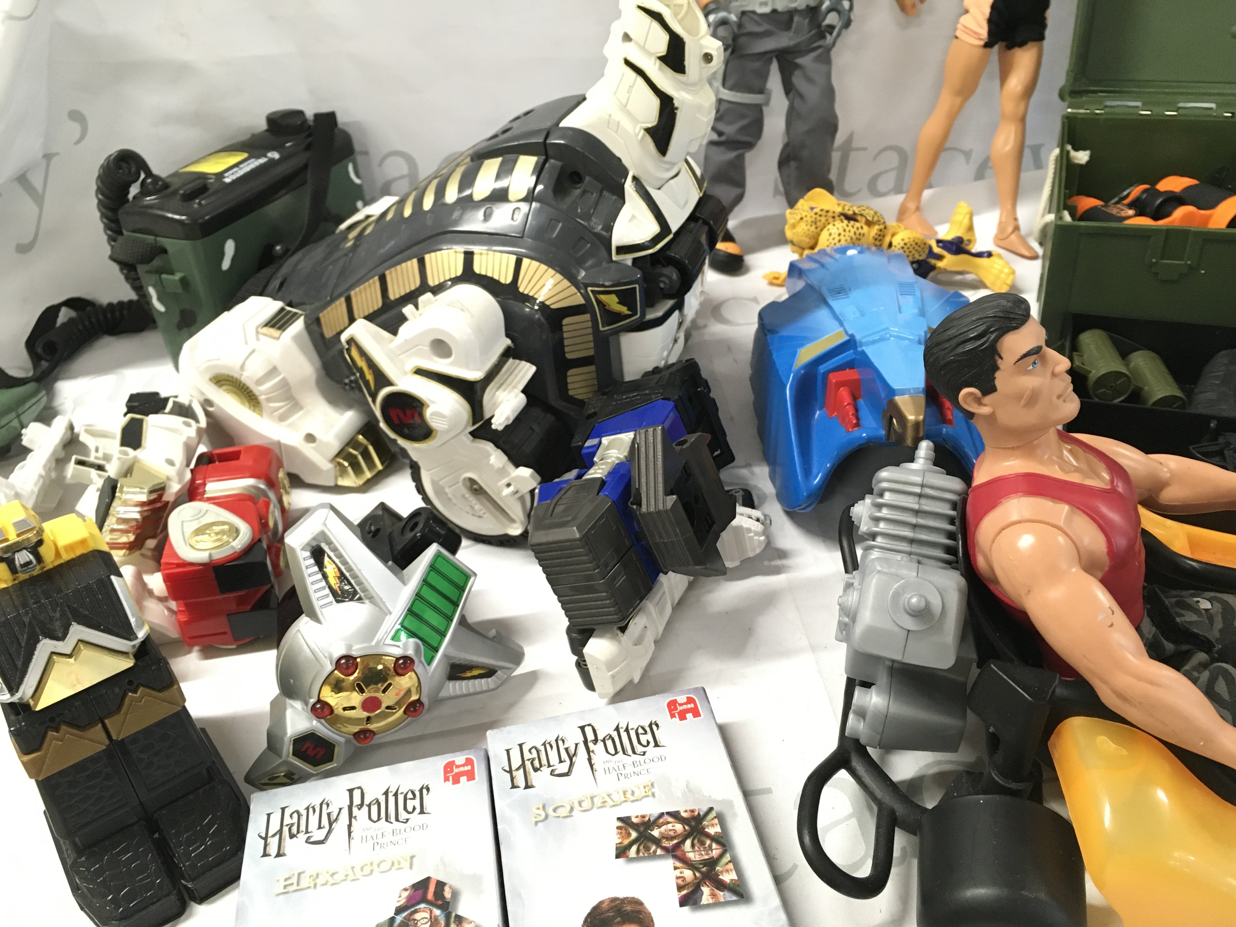 A Collection Of Playworn Toys Including Action Man. Power Rangers And Harry Potter etc.