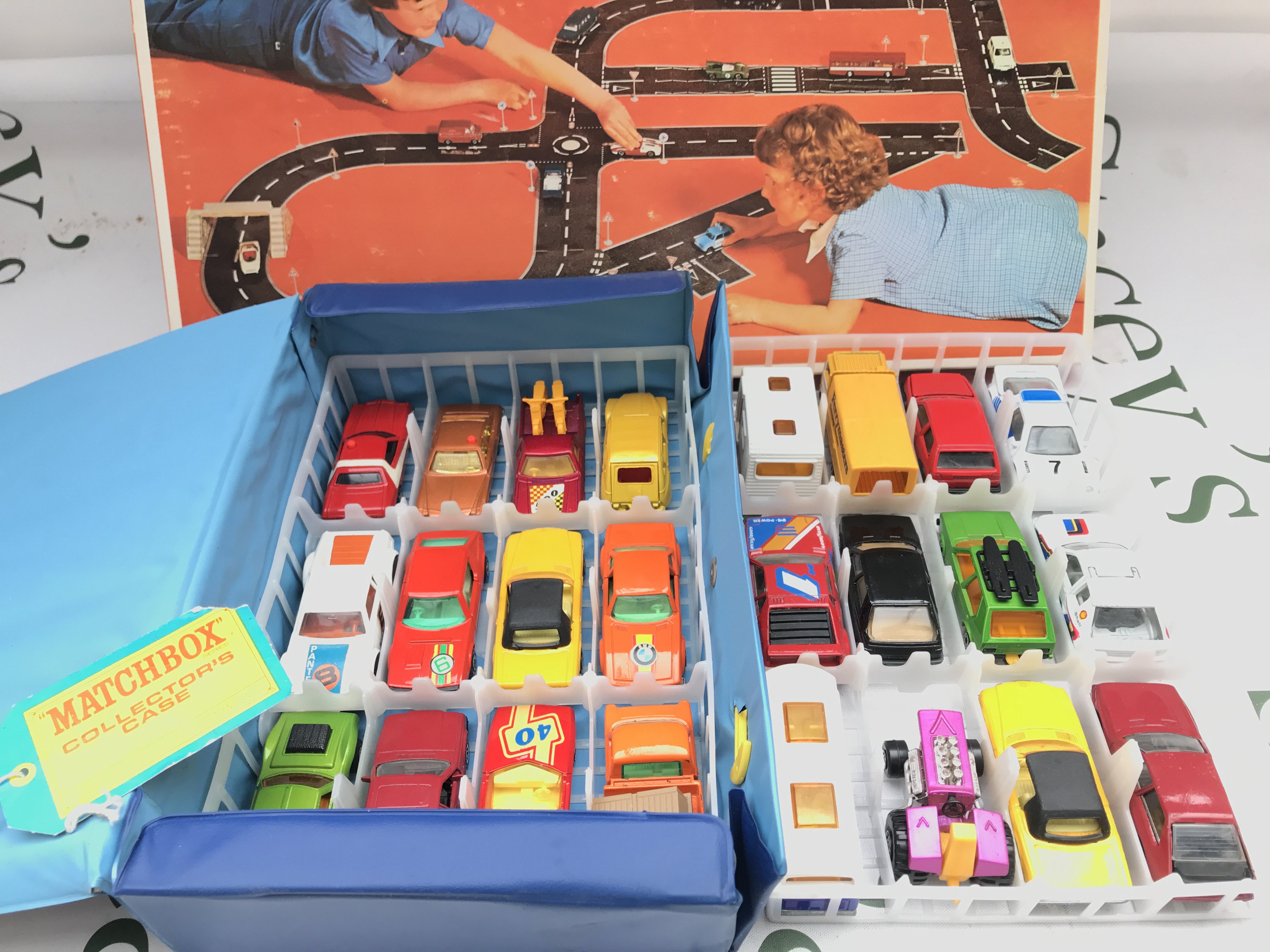 A Matchbox Carry Case With Diecast Cars in Good Condition And A Boxed Roadmaker. No Reserve.