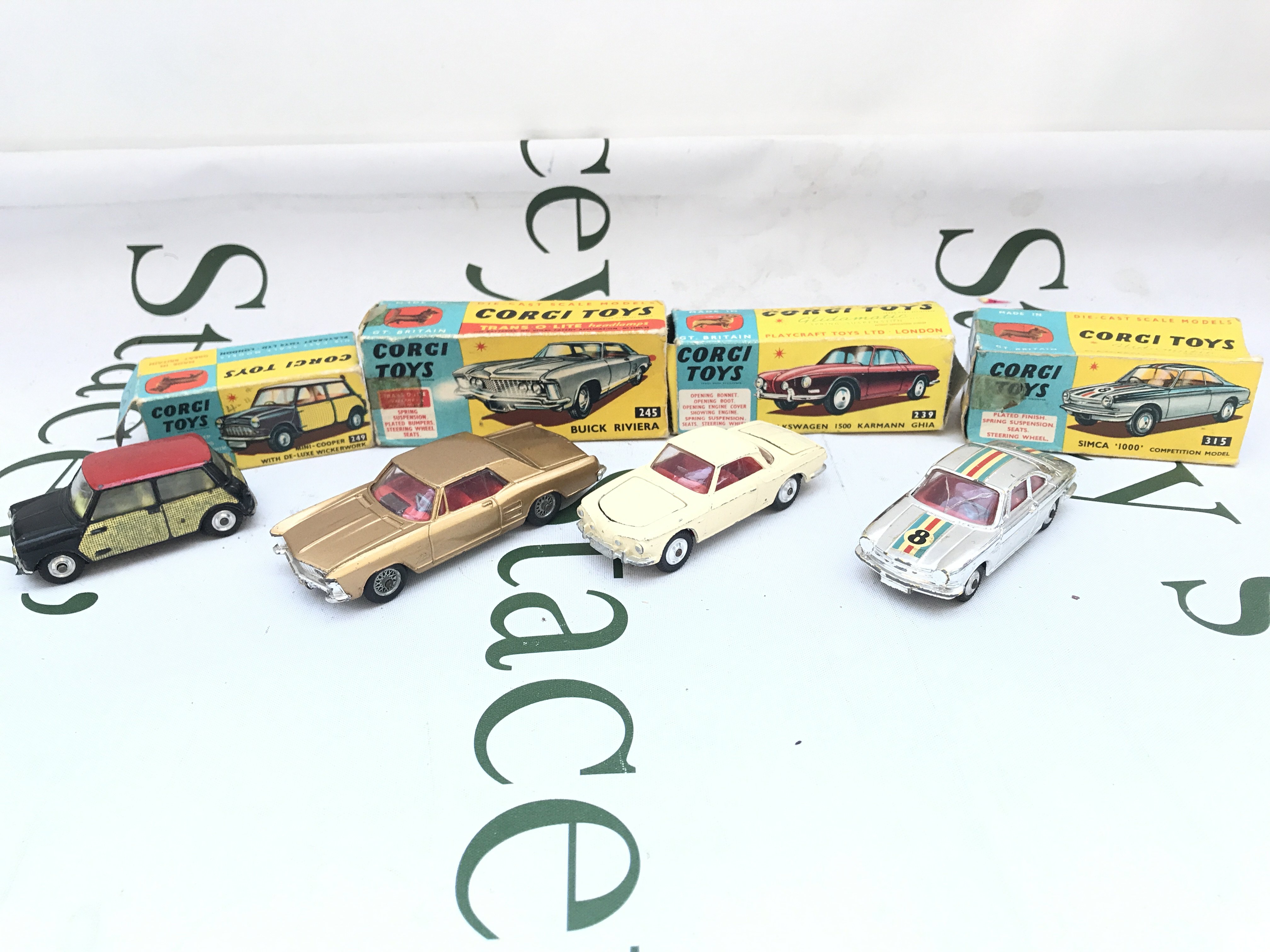 4 X Boxed Corgi Vehicles. A Mini-Cooper #249. A Buick Riviera #245. A Volkswagen 1500 #239 And A Simca 1000 #315. Boxes Are Worn.