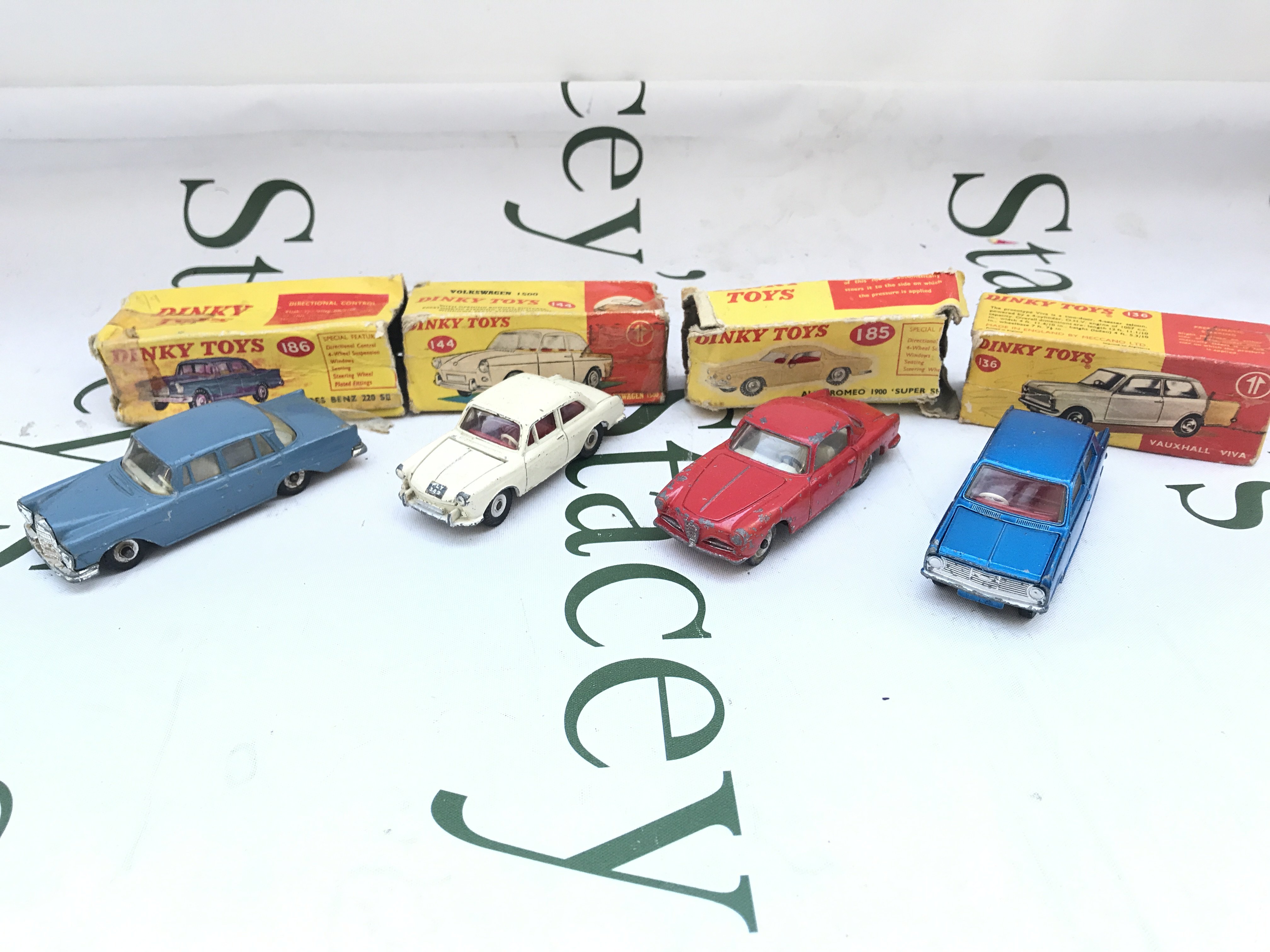 4 Boxed Dinky Vehicles. A Mercedes Benz. A Volkswagen 1500. A Alfa Romeo And Vauxhall Viva. Boxes Are Worn Cars Are Playworn.