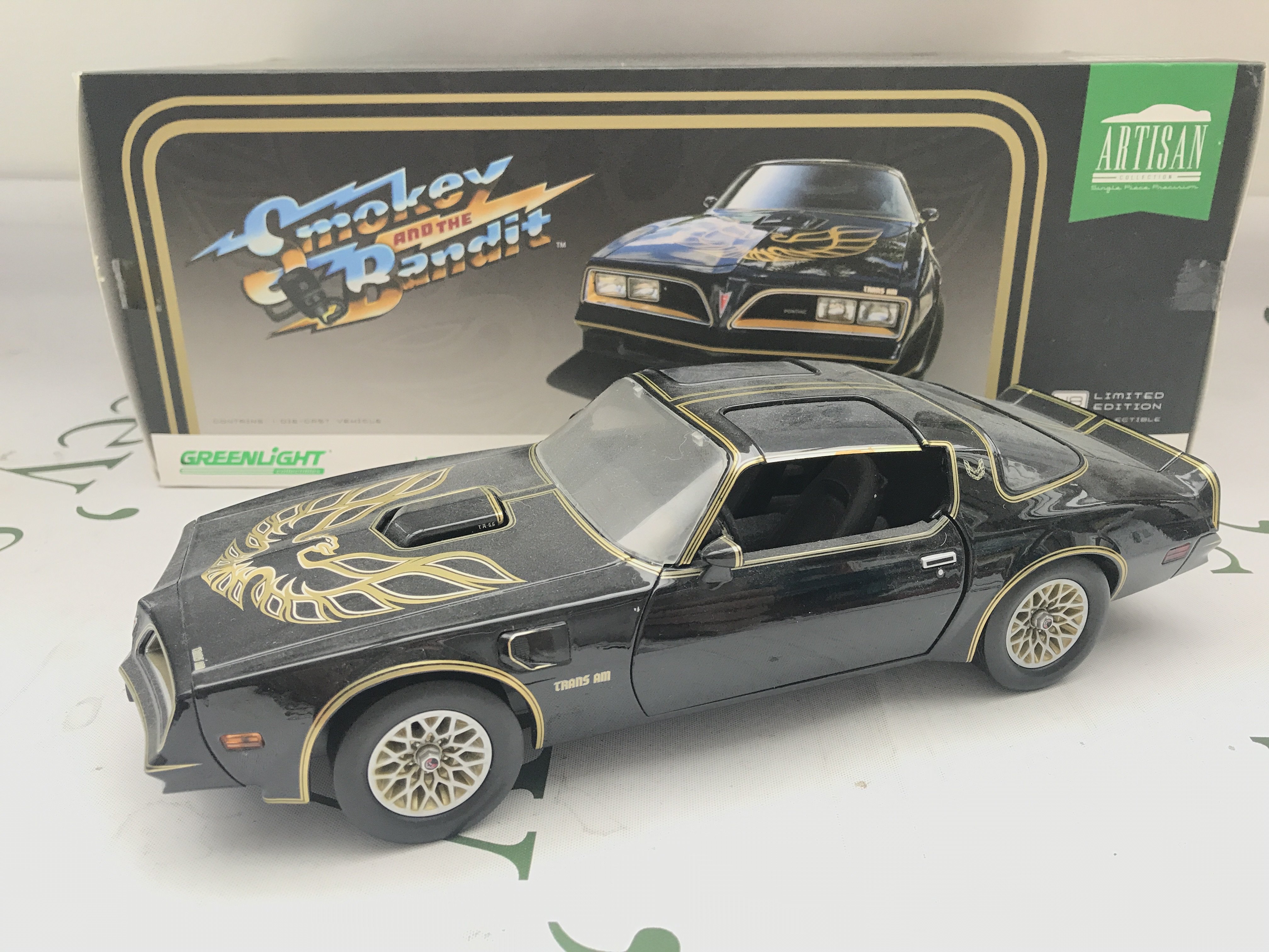 A 1/18 Scale Greenlight 1977 Pontiac Firebird From Smokey And The Bandit.