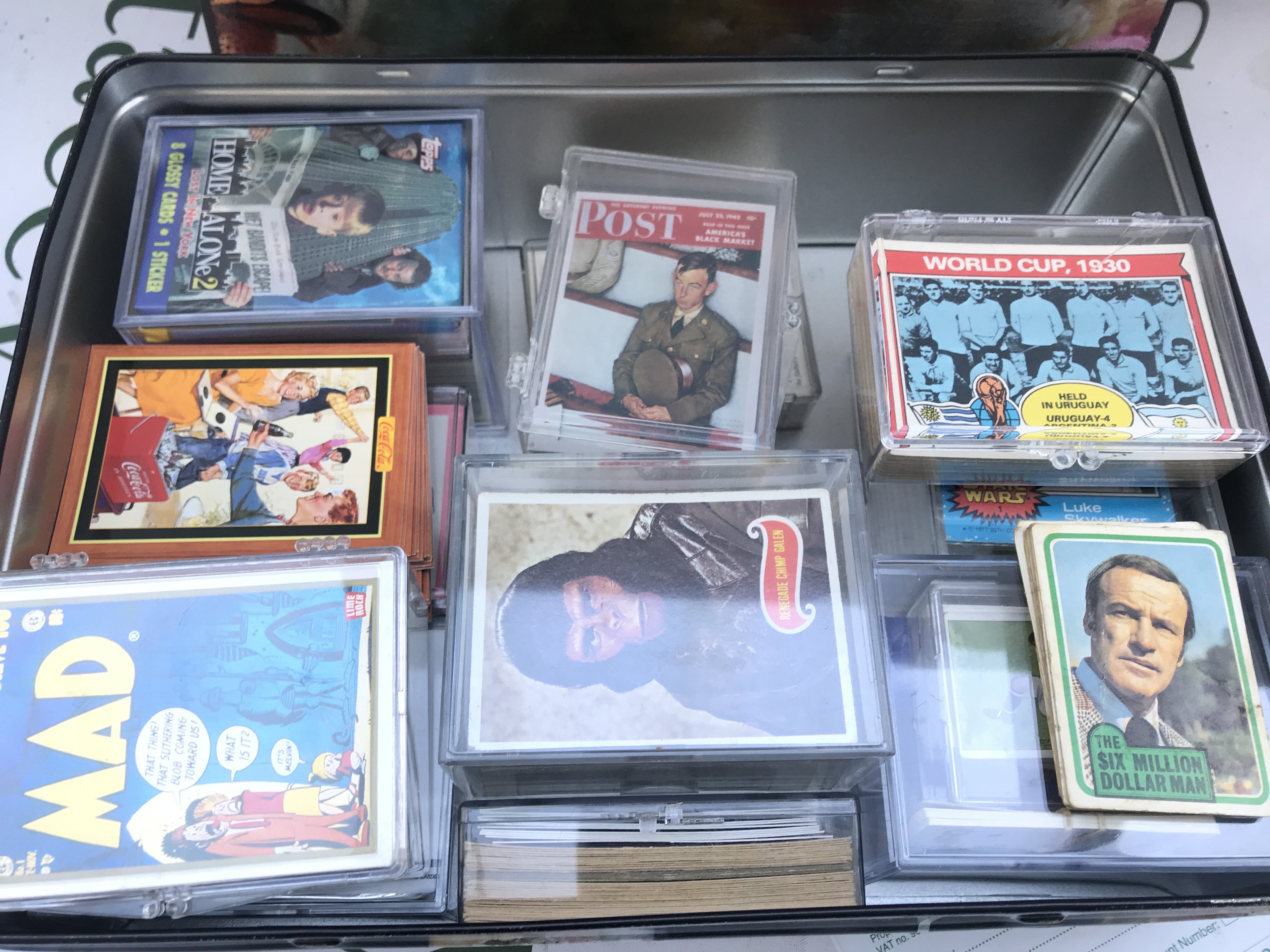A Tin Containing Various Collectors Cards. Including Star Wars. Planet Of The a Apes. Home Alone 2. Mad And Topps Footballer. No Reserve.