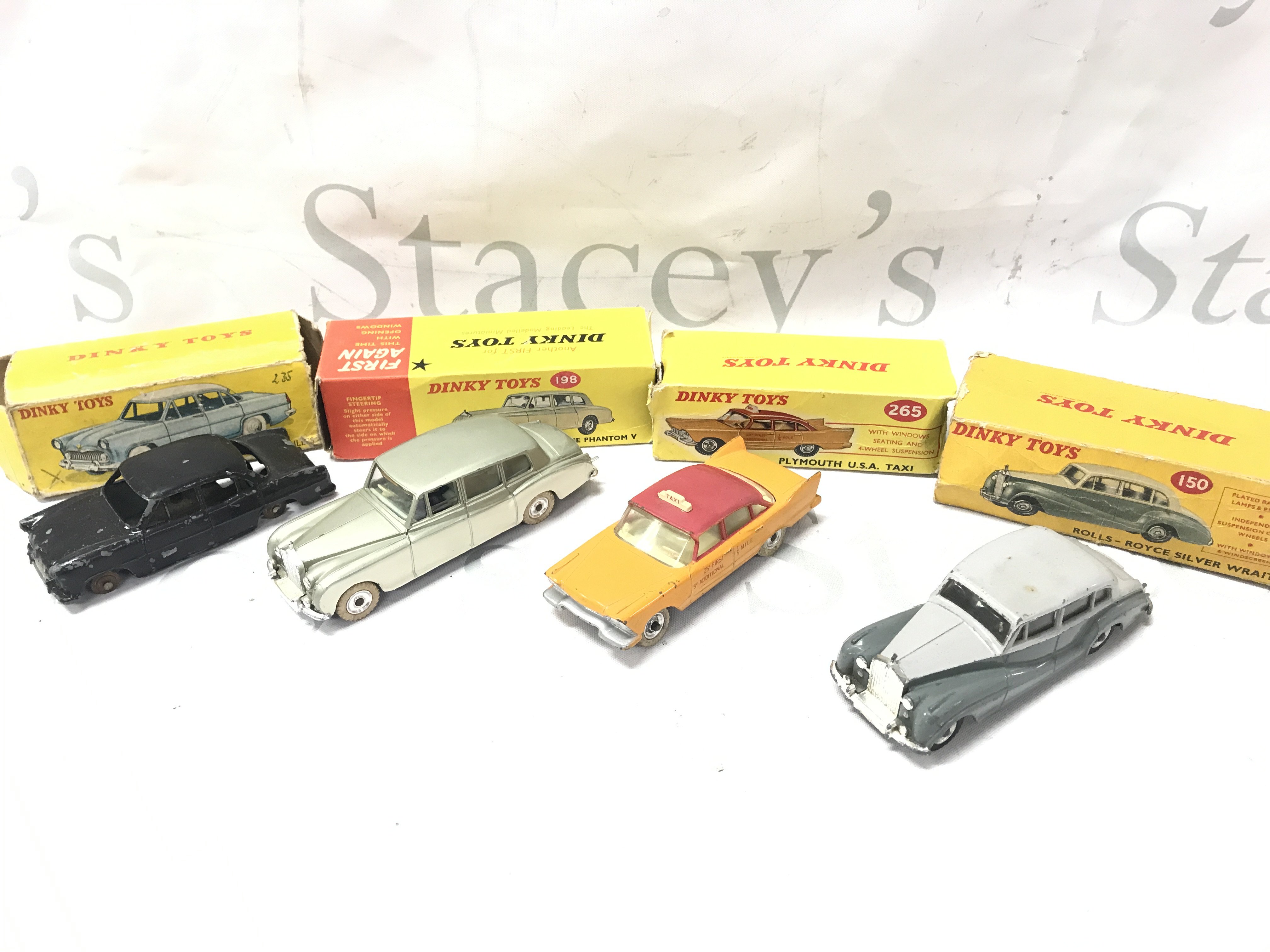 4 Boxed Dinky Toys Vehicles. All Playworn and Boxes Are Worn. A Simca Versailles #24Z. A Rolls-Royce Phantom V #198. A Plymouth USA Taxi #265 And A Rolls-Royce Silver Wraith #150. No Reserve.