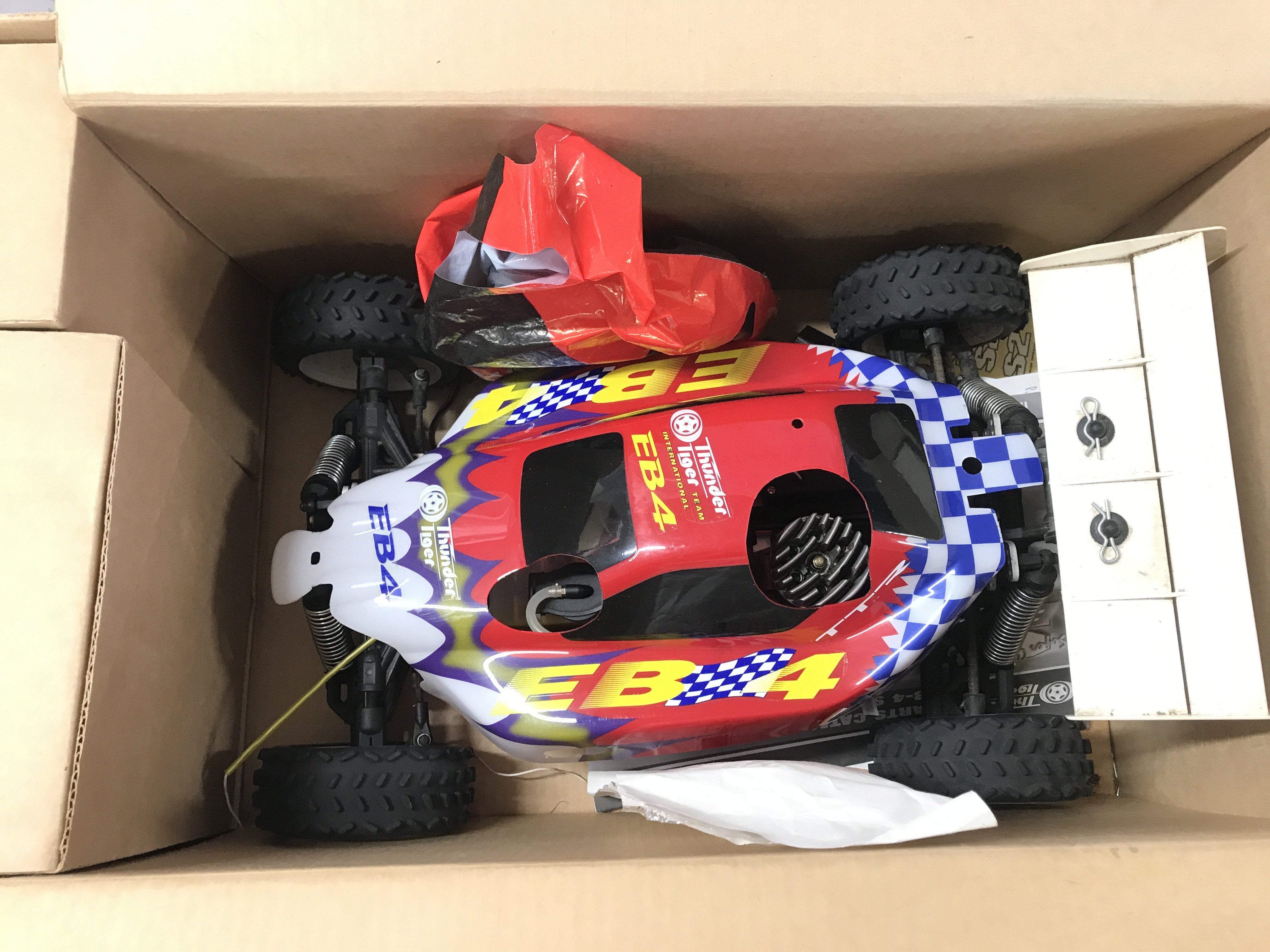 A Boxed Super Combo Thunder Tiger 1/8 Scale Remote Controlled Car.