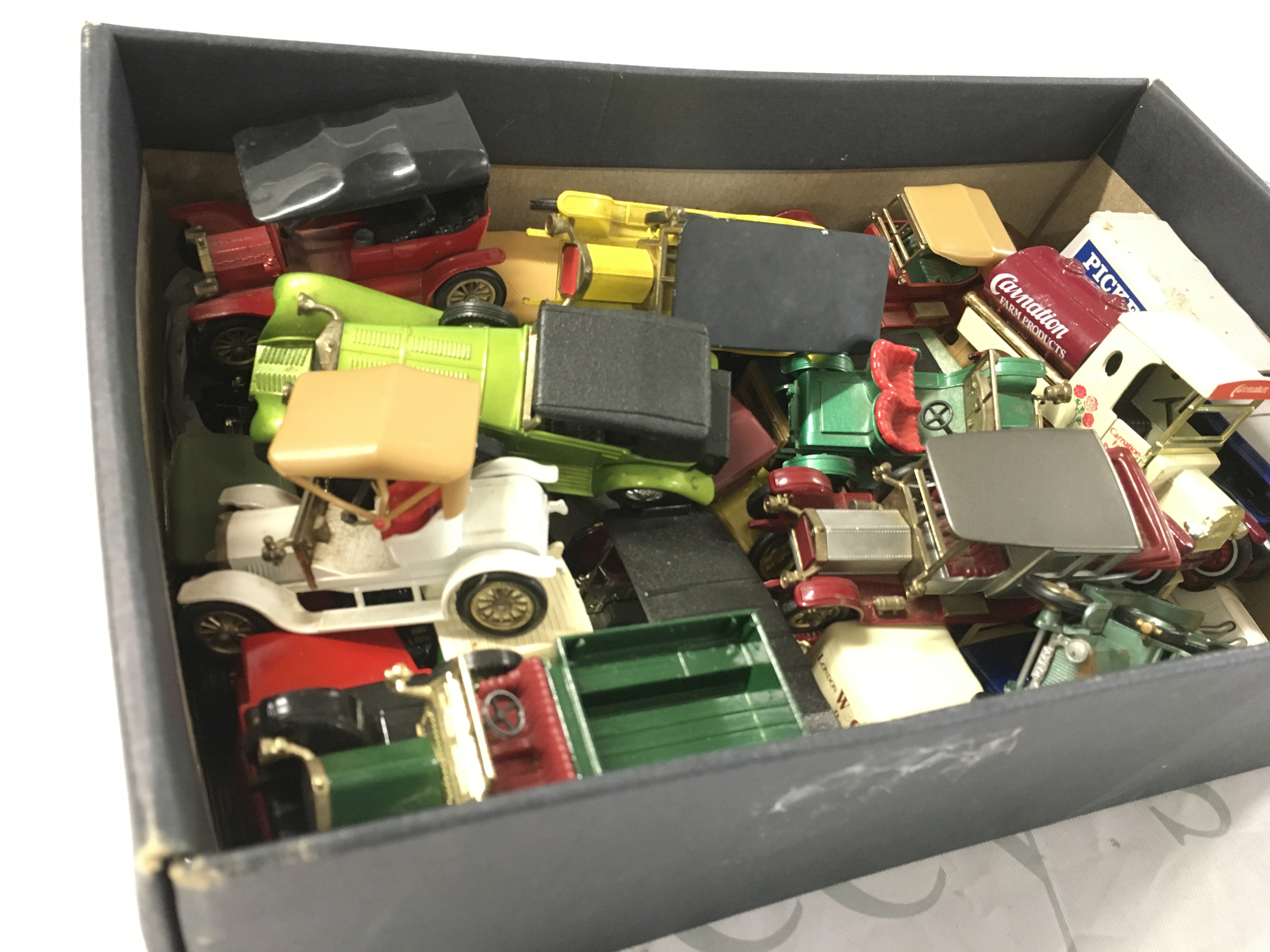 A box containing a collection of Matchbox diecast model vehicles from the Models of Yesteryear series. No reserve