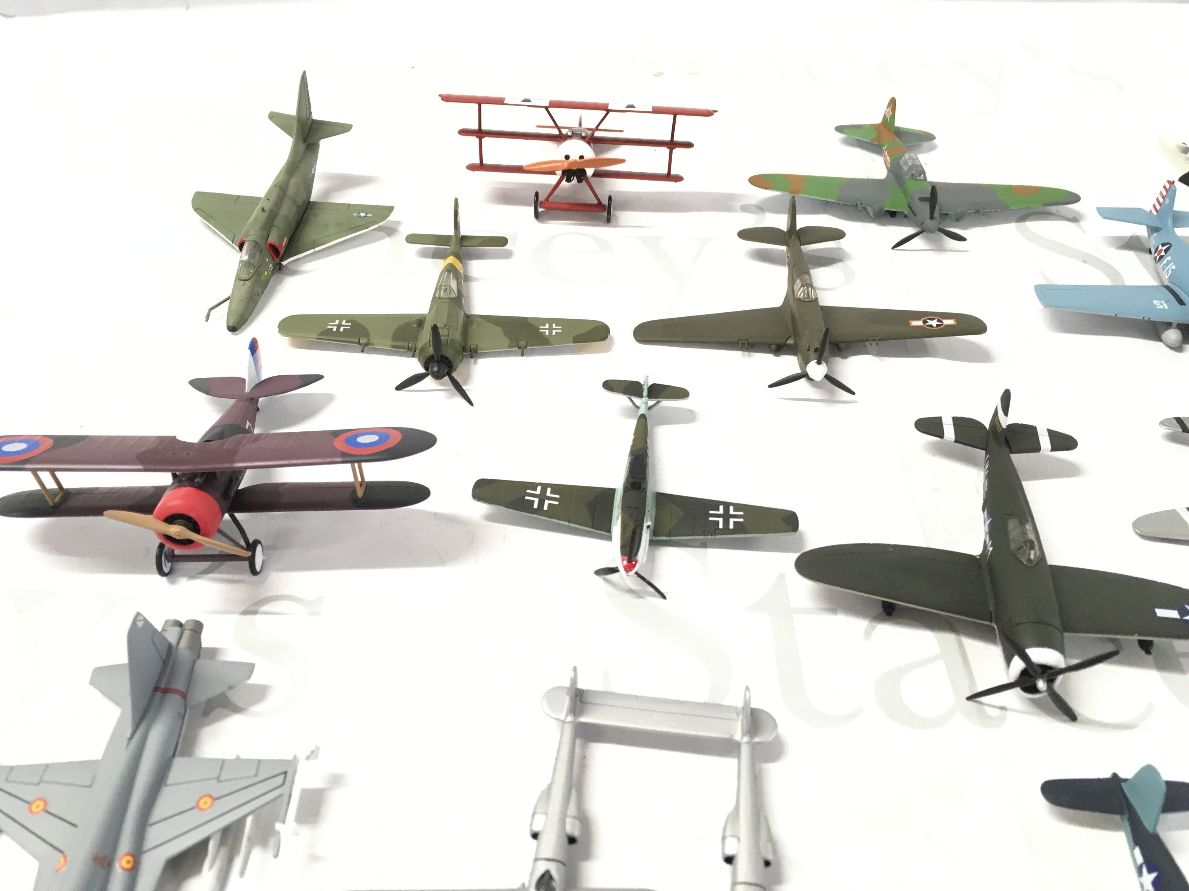 A small collection of metal model military aircraft. Stands included. No reserve.