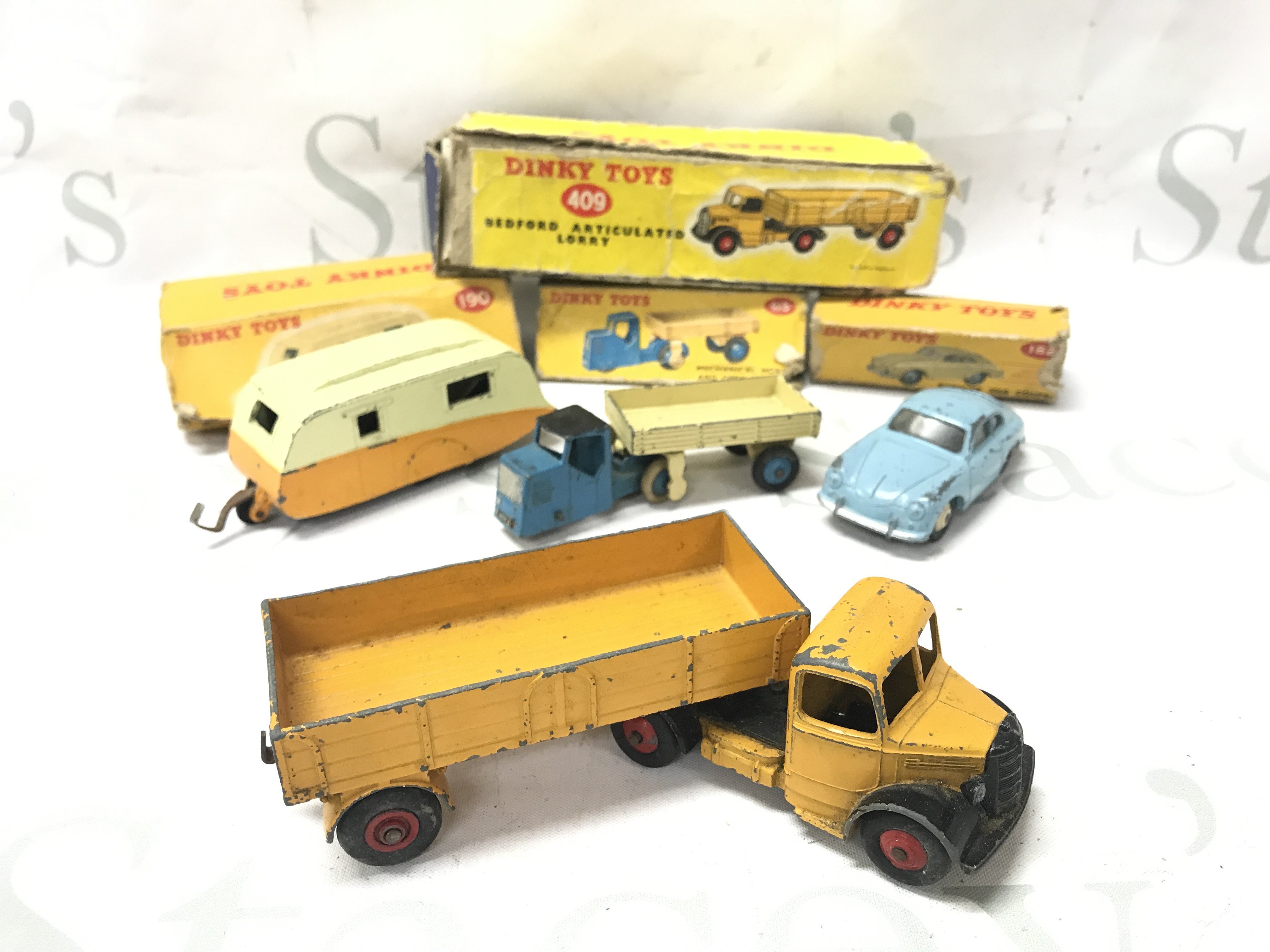 4 X Boxed Dinky Vehicles. All Playworn And Boxes Worn. A Caravan #190. A Bedford Articulated Lorry #409. A Mechanical Horse And Open Wagon #415 And A Porsche 356A Coupe. No Reserve.