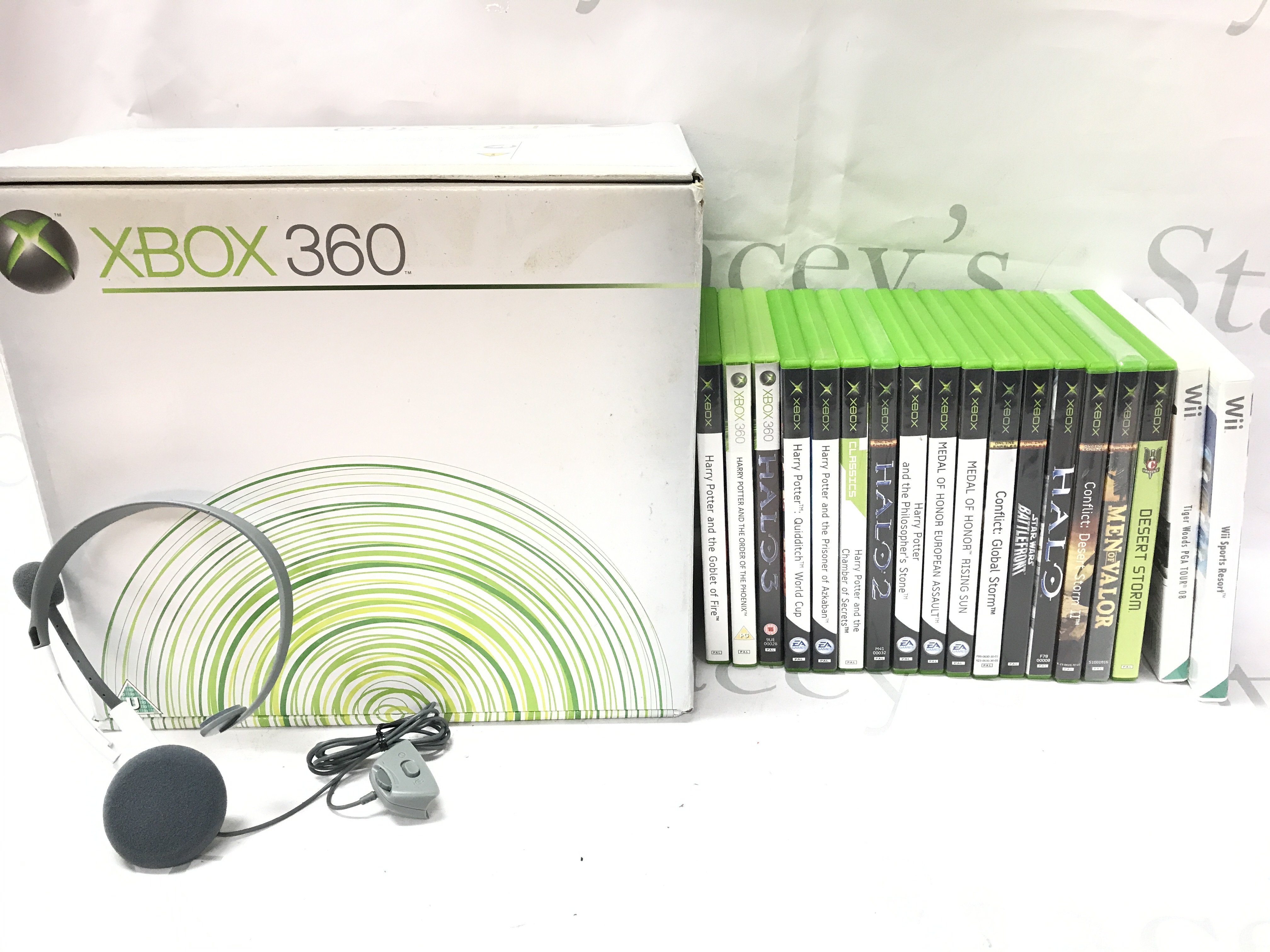 A Boxed Microsoft Xbox 360 with A Collection Of Games.